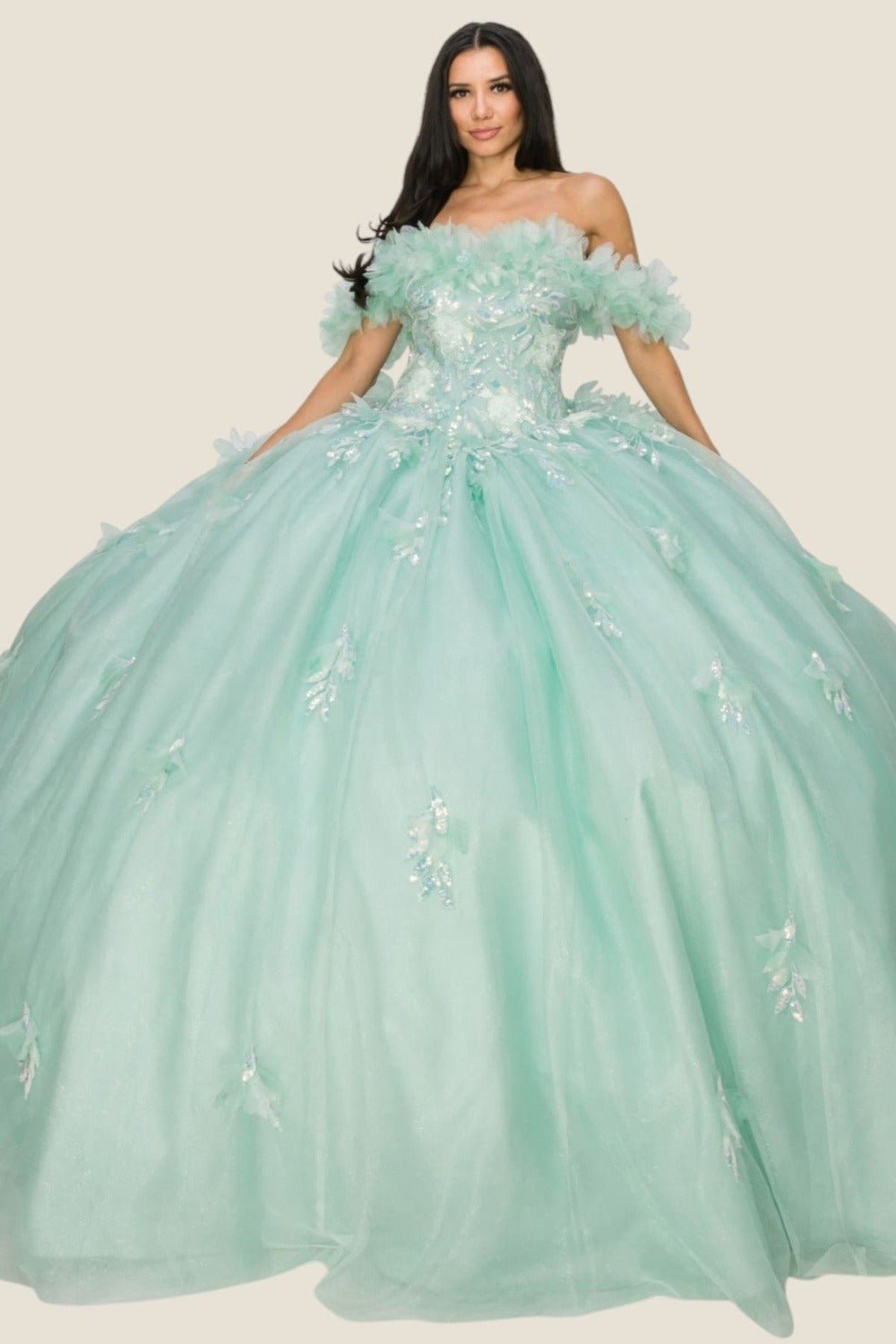 Front view of a woman wearing an aqua blue quinceanera dress with rainbow embroidery, sequin ruffle flowers, and off-shoulder neckline