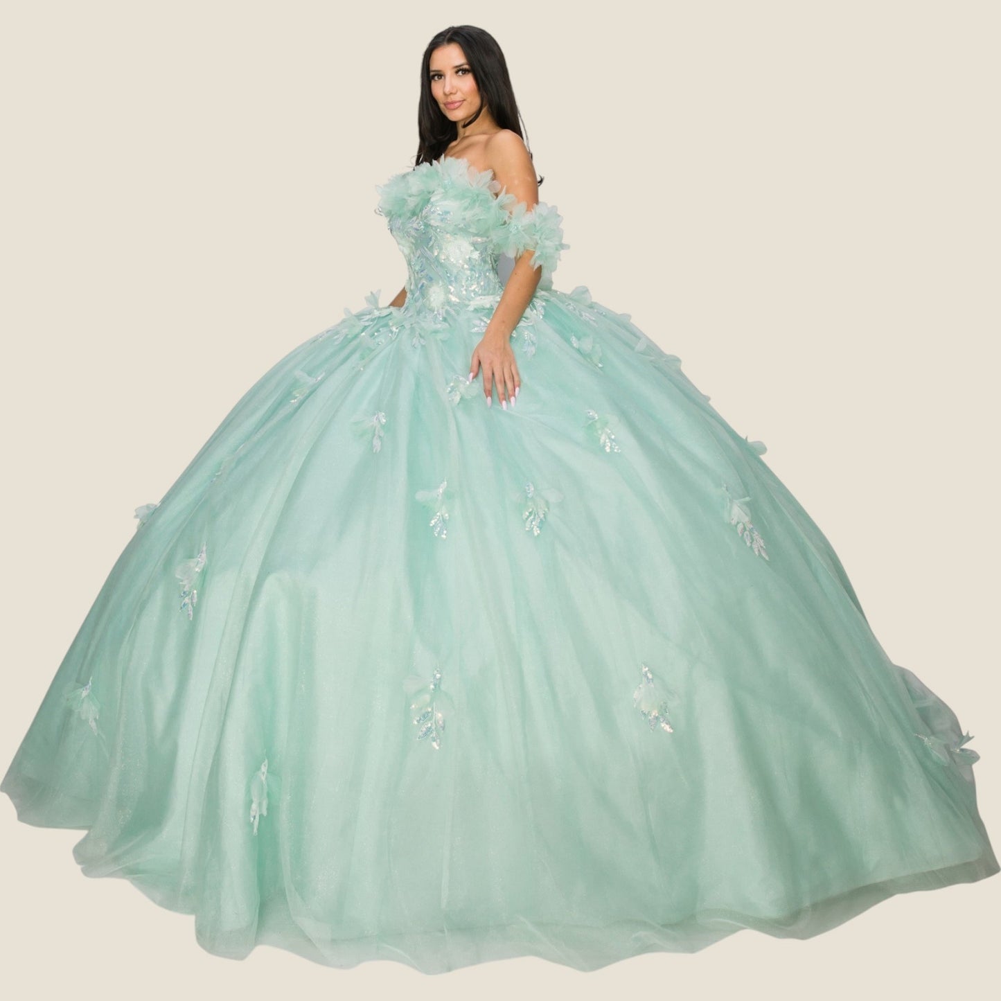 Side view of a woman wearing an aqua blue quinceanera dress with rainbow embroidery, sequin ruffle flowers, and flowing accents