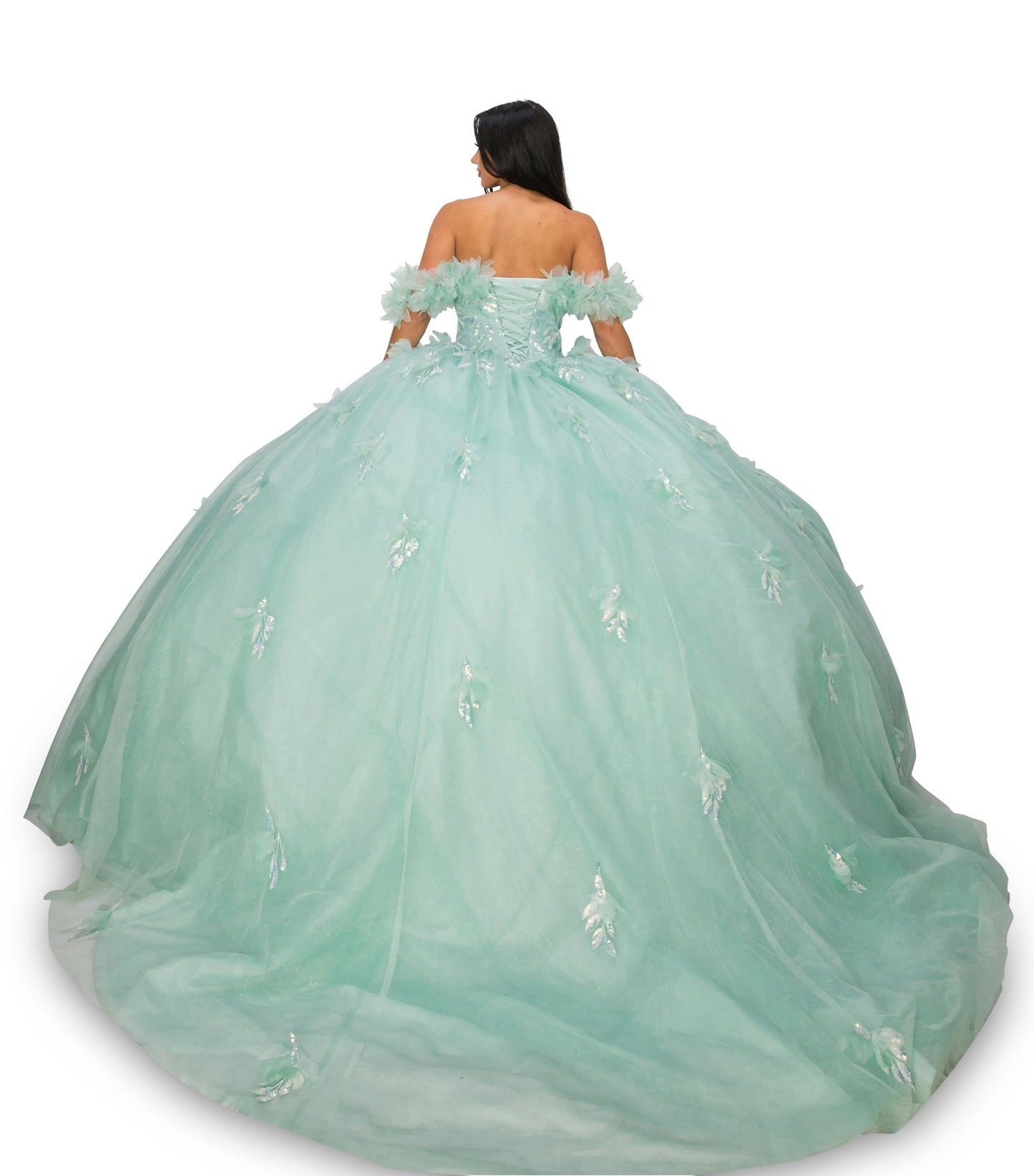 Back view of a woman wearing an aqua blue quinceanera dress with rainbow embroidery, sequin ruffle flowers, and off-shoulder neckline