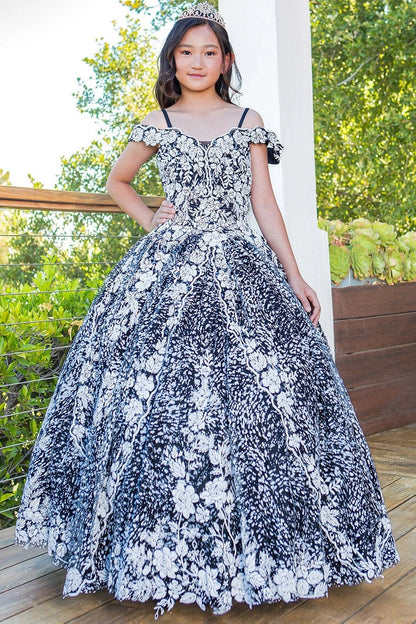 Shown in a front view, the Black mini quince dress has contrasting floral lace, off-shoulder sleeves and a full ball skirt.