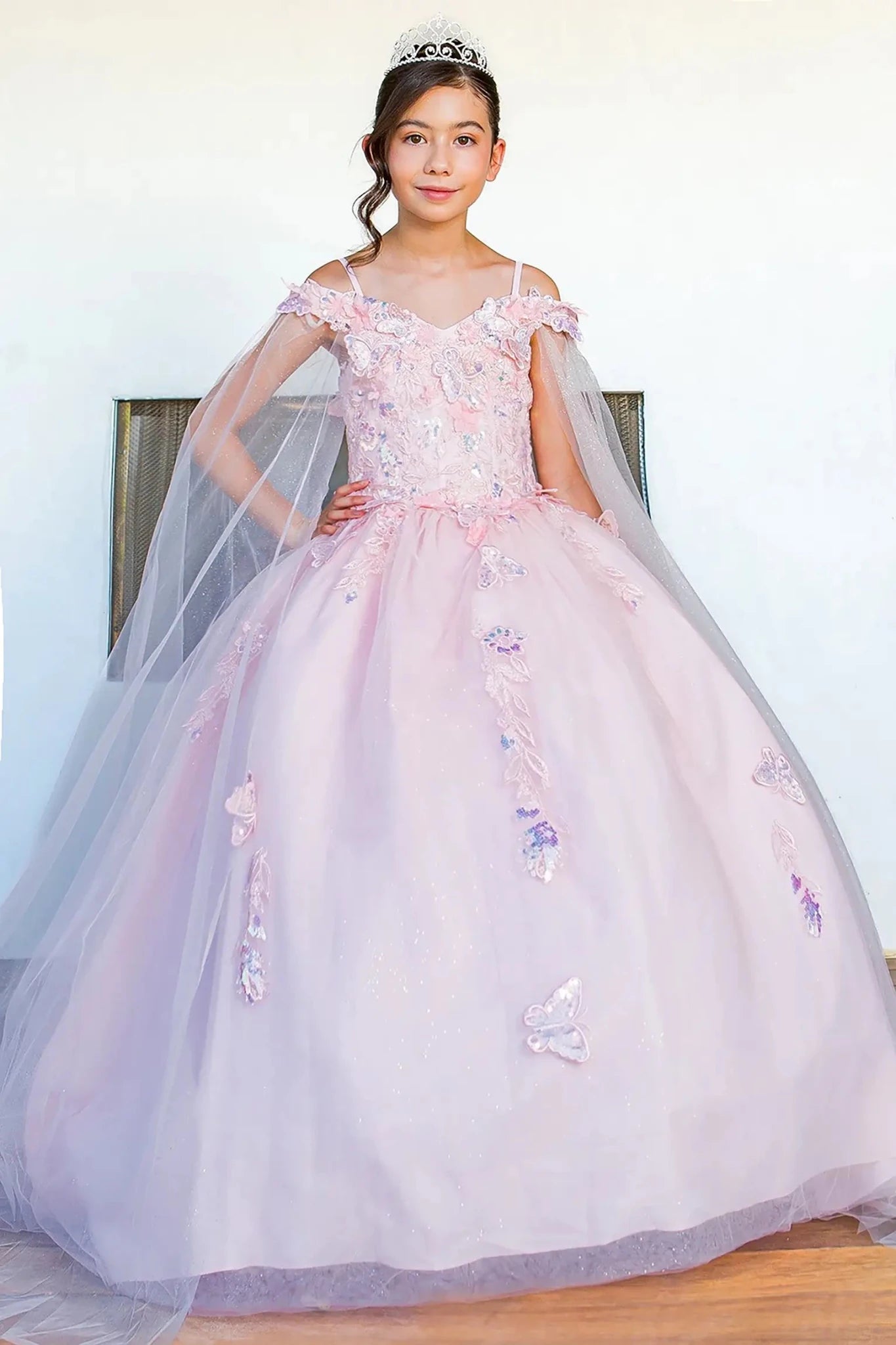 Front view of blush mini quince dress with 3D butterfly applique detachable sleeves glitter tulle skirt.