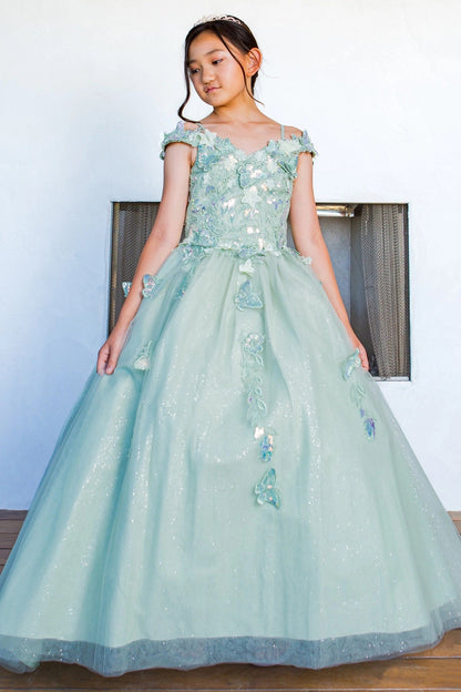 Displayed in a front view, the Sage mini quince dress has floral appliques and off-shoulder straps above the full skirt.