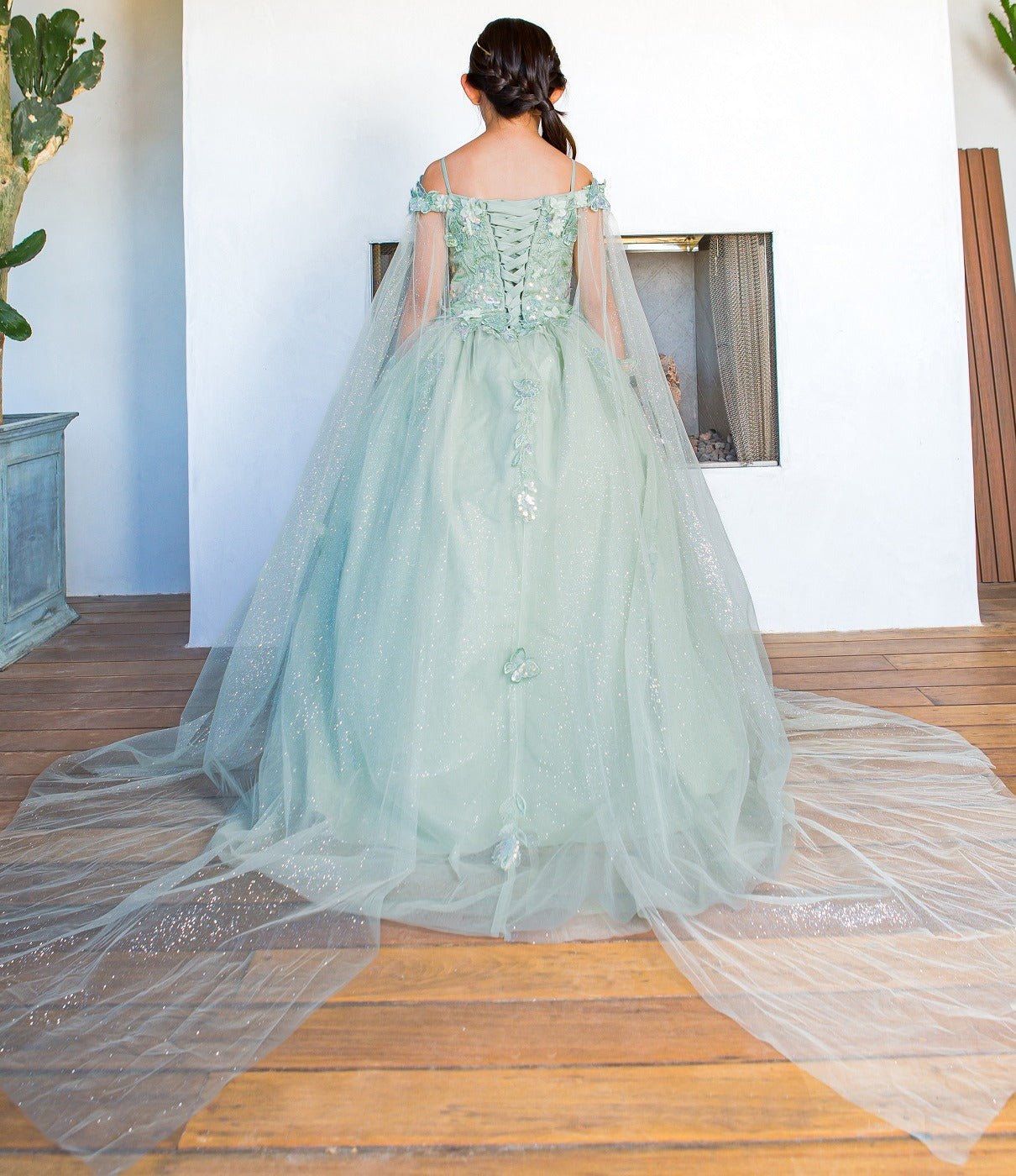Front view of sage mini quince dress with 3D butterfly applique detachable sleeves long tulle train.