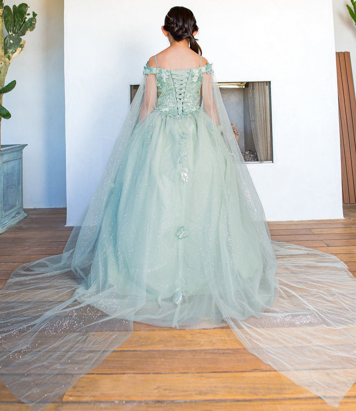 Front view of sage mini quince dress with 3D butterfly applique detachable sleeves long tulle train.