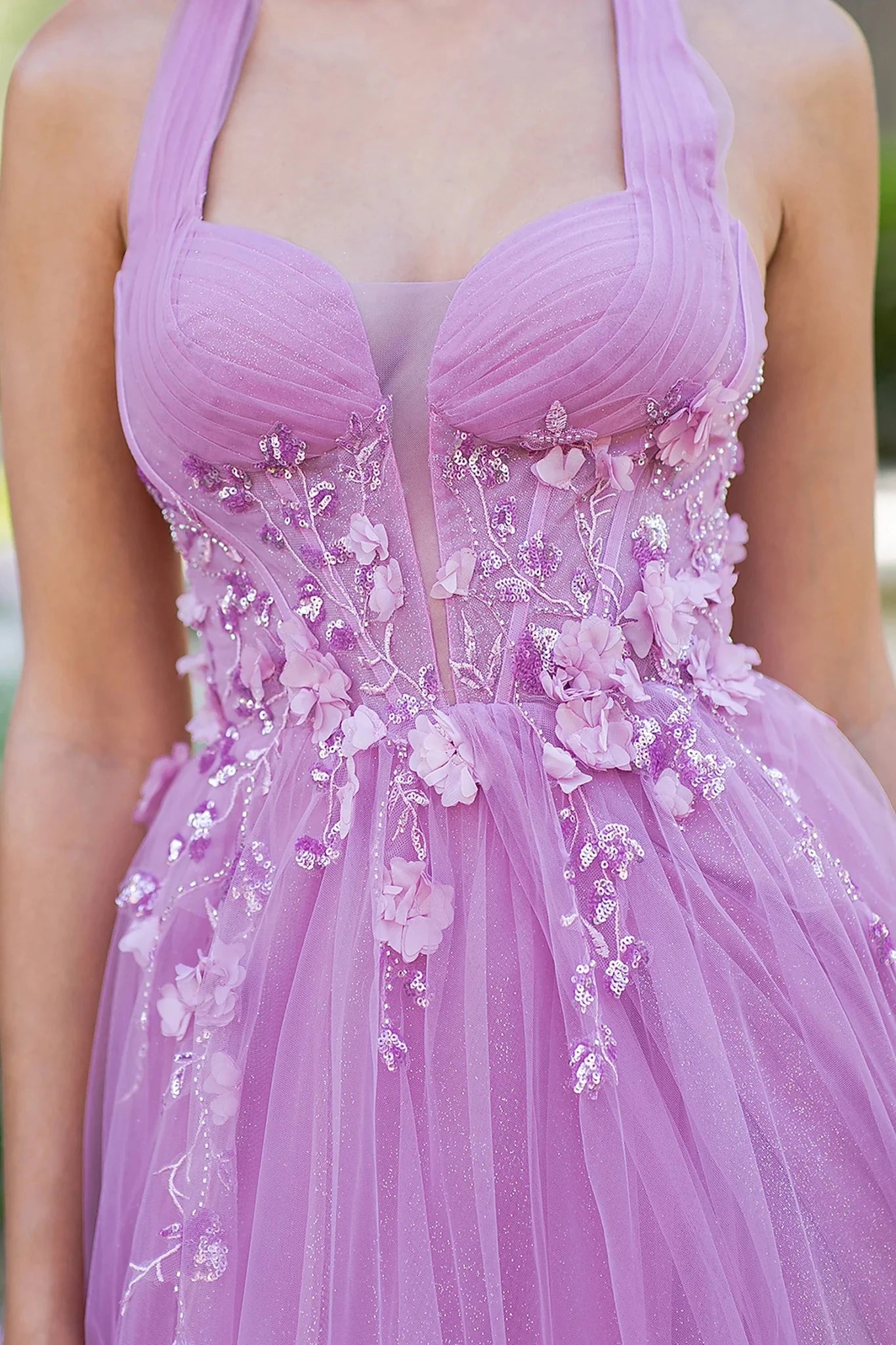 Pink prom dress featuring floral appliques and glitter print pattern