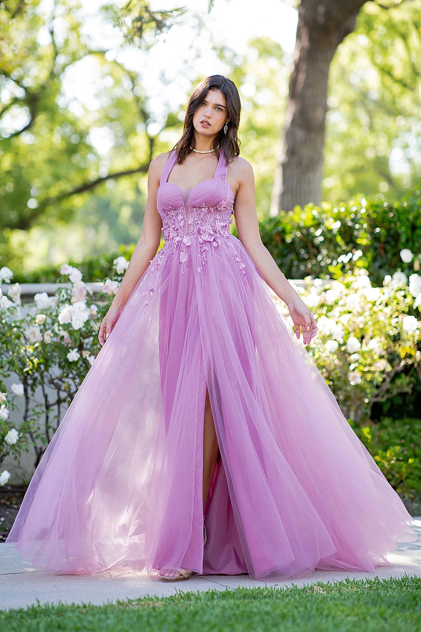 Pink prom dress showcasing layered tulle with high leg slit skirt