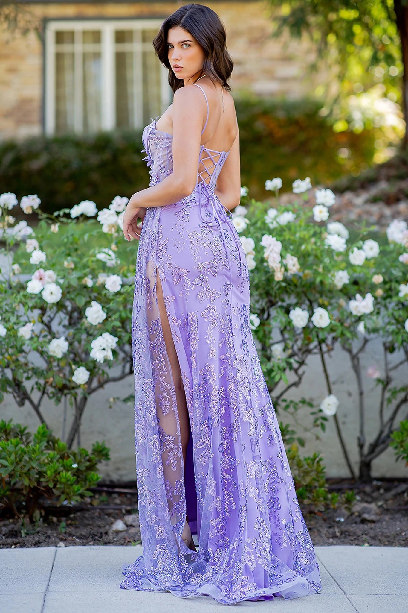 Lilac prom dress completed with lace-up back straps and zipper closure