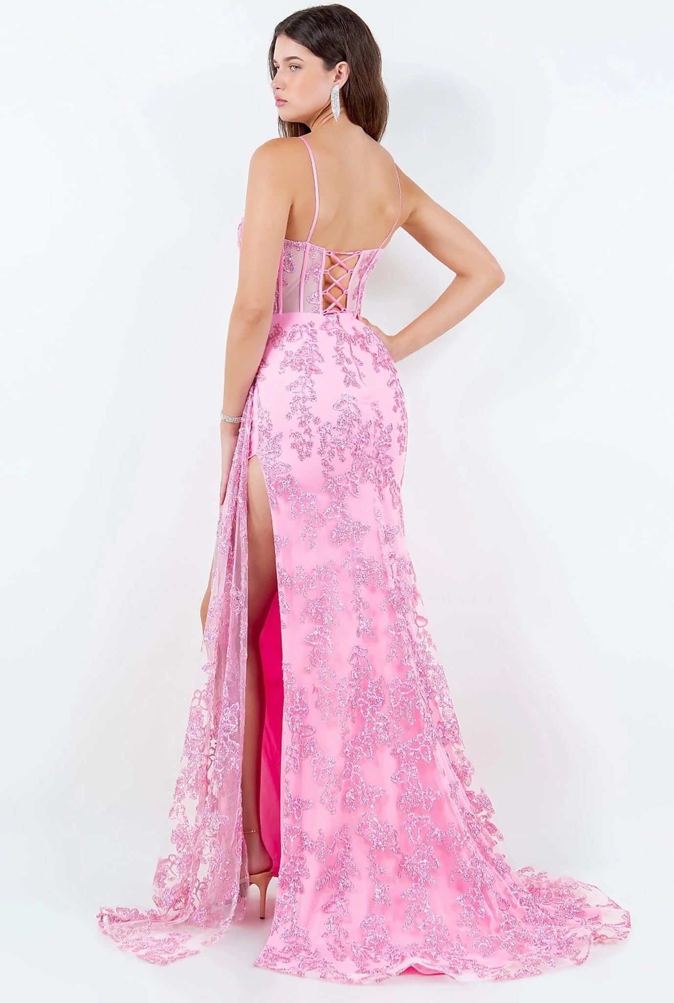 Pink prom dress completed with lace-up back straps and zipper closure