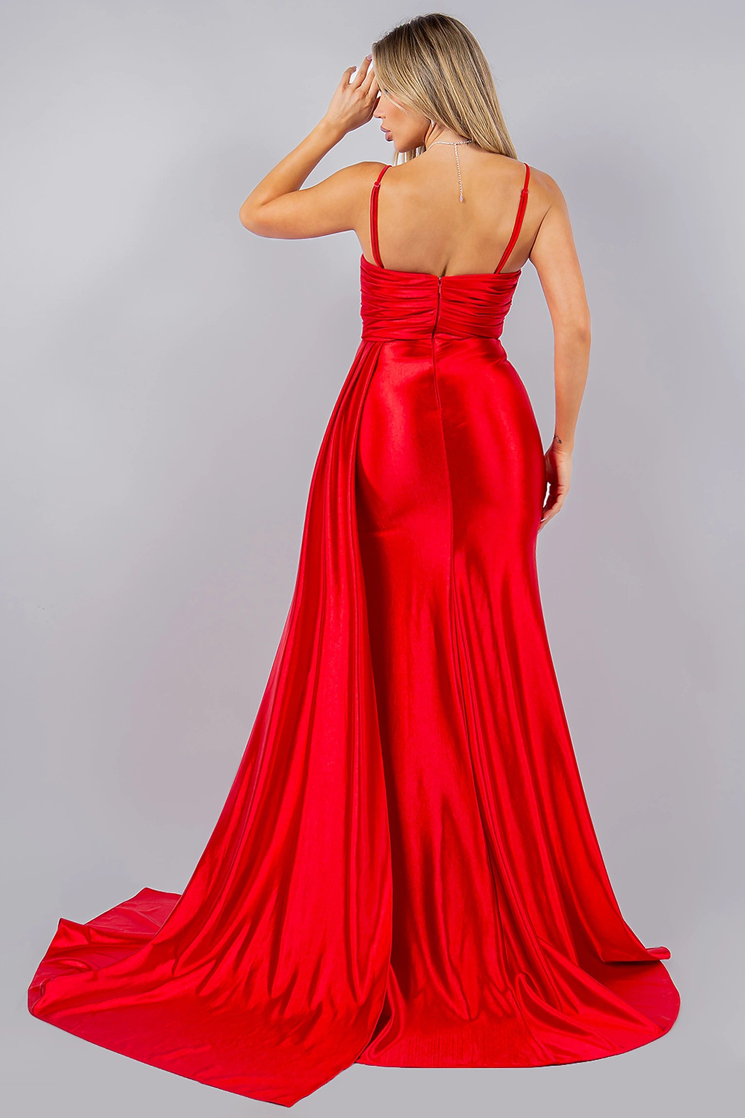 Red evening dress designed with zipper back closure and structured fit