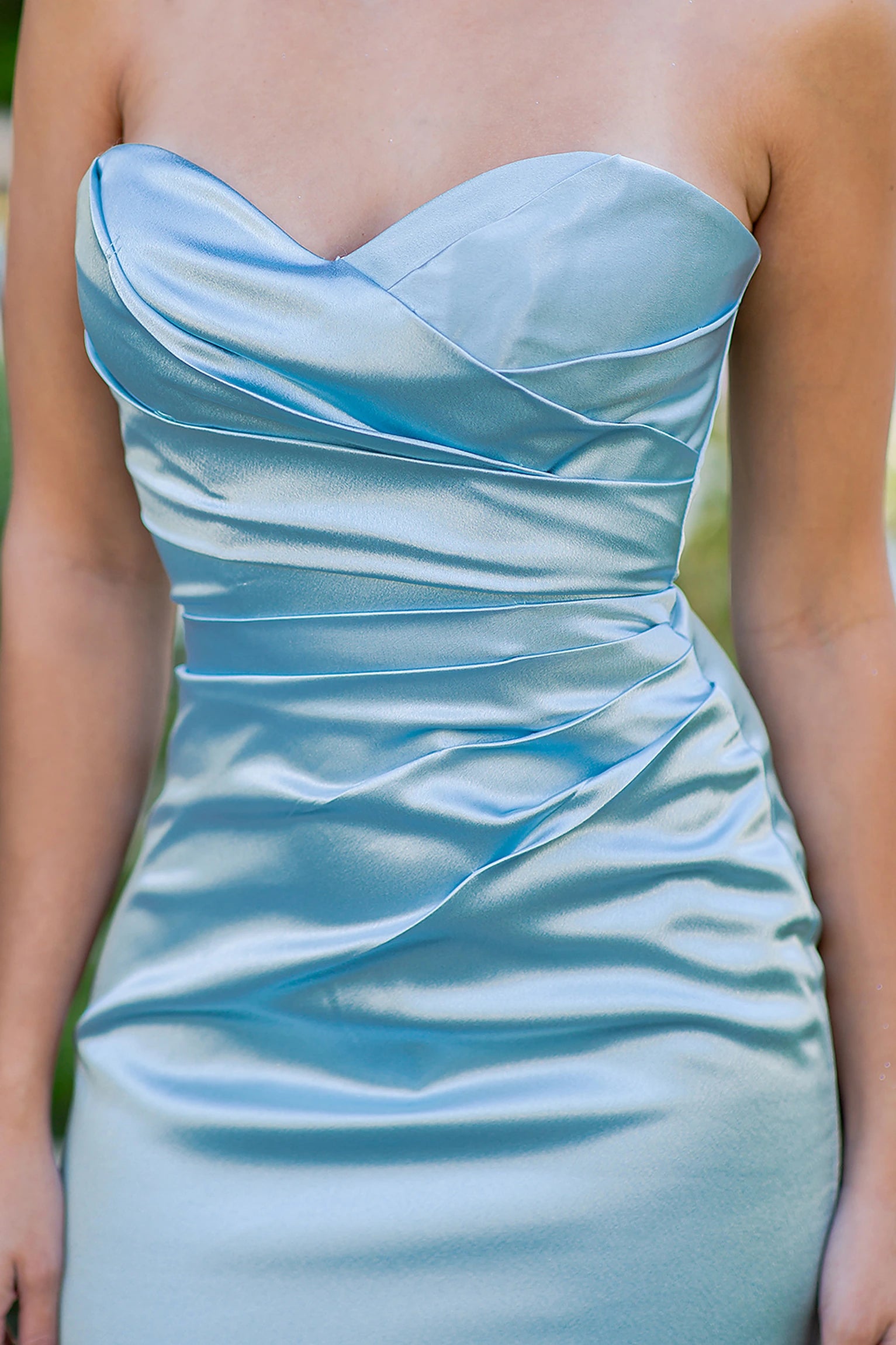 Light Blue prom dress featuring diagonal pleats across satin bodice