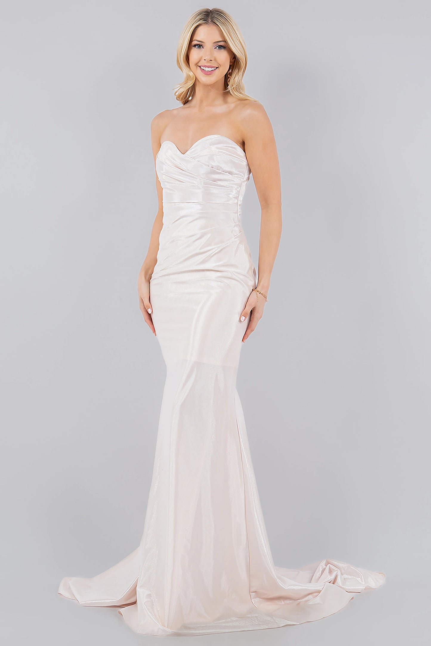 Ivory prom dress completed with horsehair-trimmed hem and train