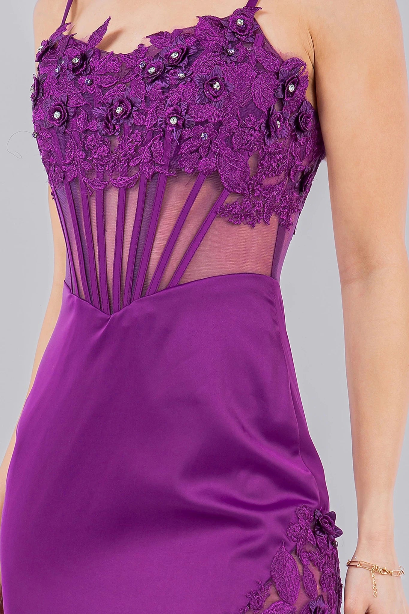 Grape spaghetti strap gown featuring fitted silhouette with structured corset design