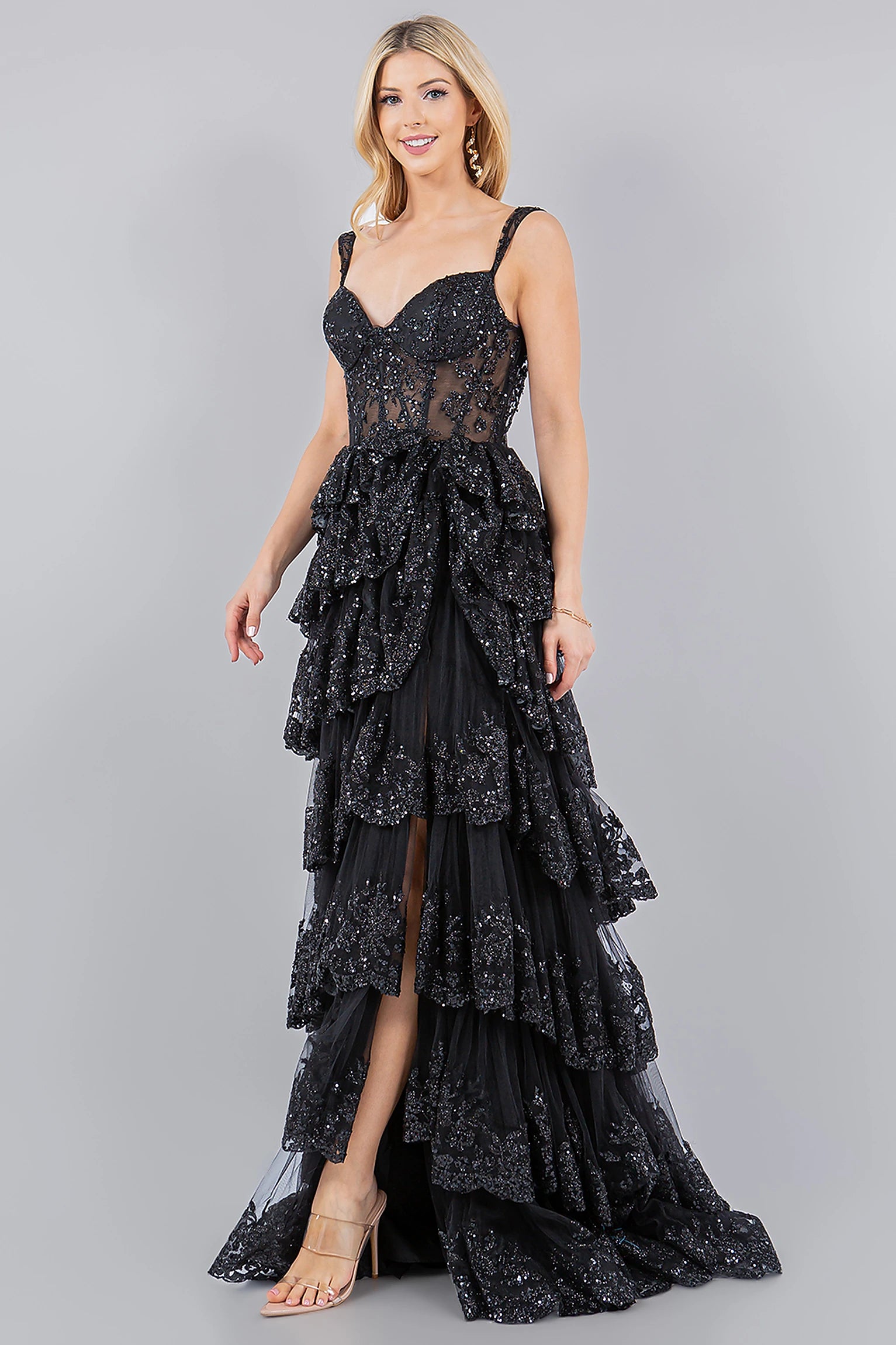 Black evening dress completed with floor-length silhouette and sweep train