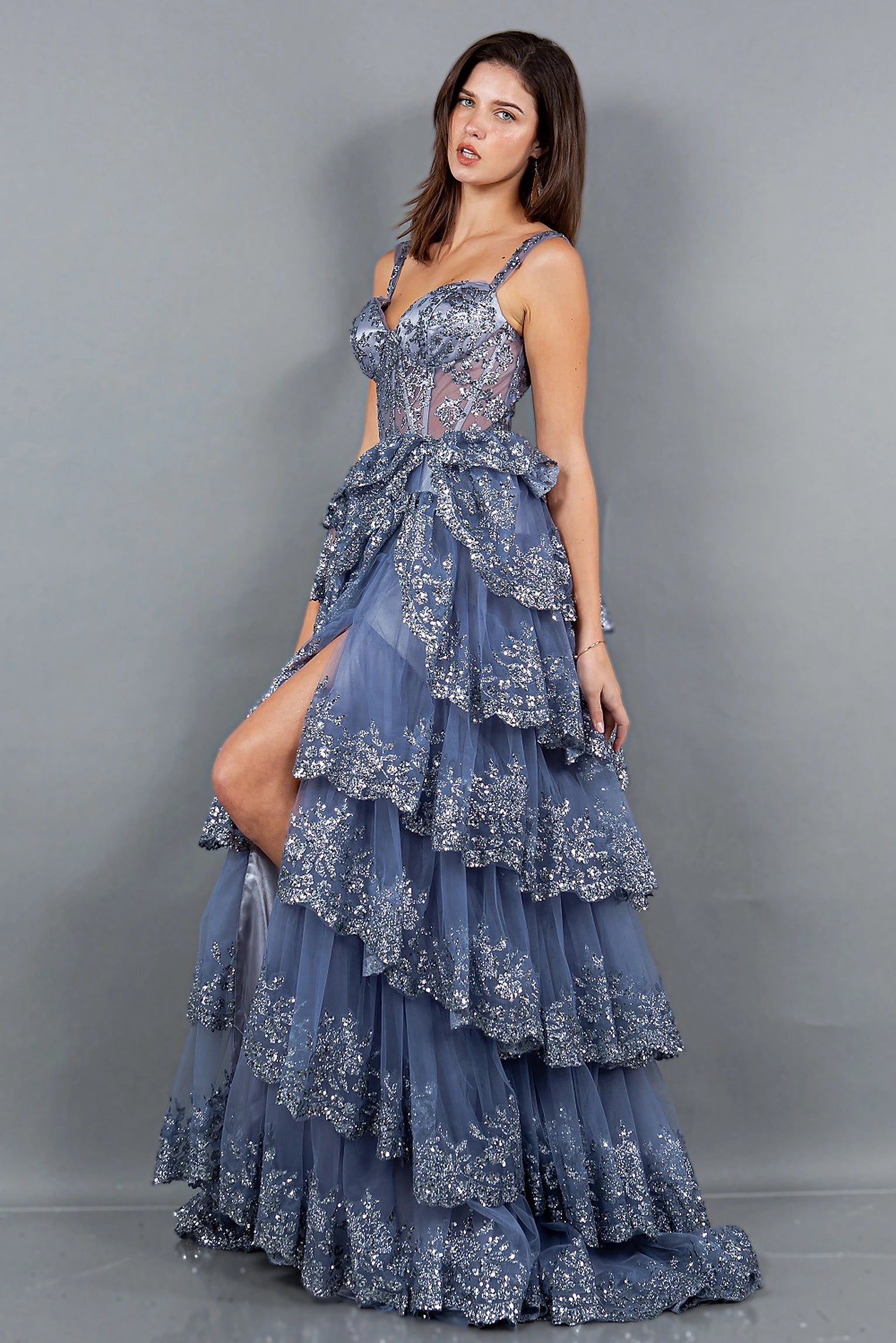 Smoky blue evening dress showcasing ruffled tiered skirt with high side slit