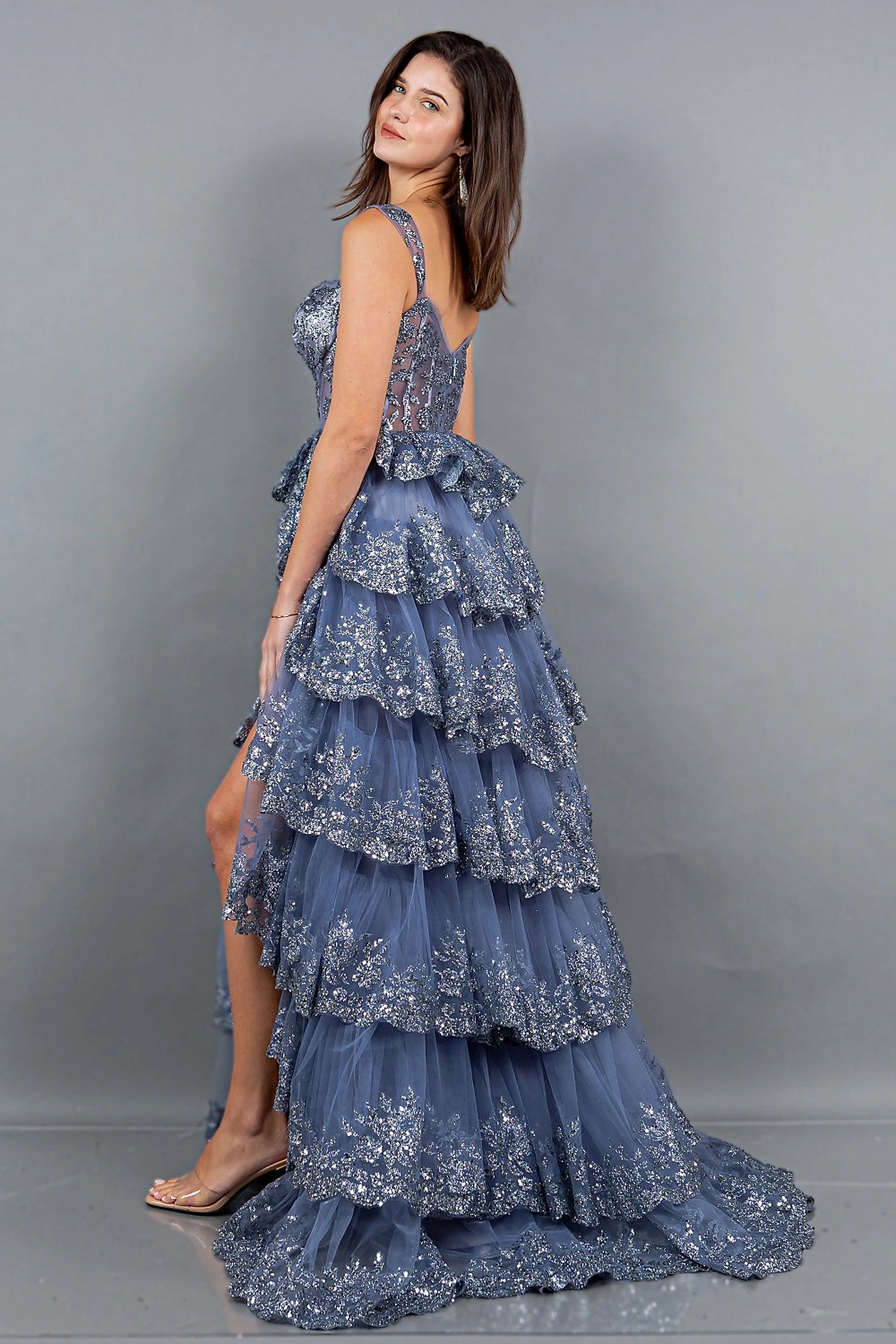 Smoky blue evening dress completed with floor-length silhouette and sweep train