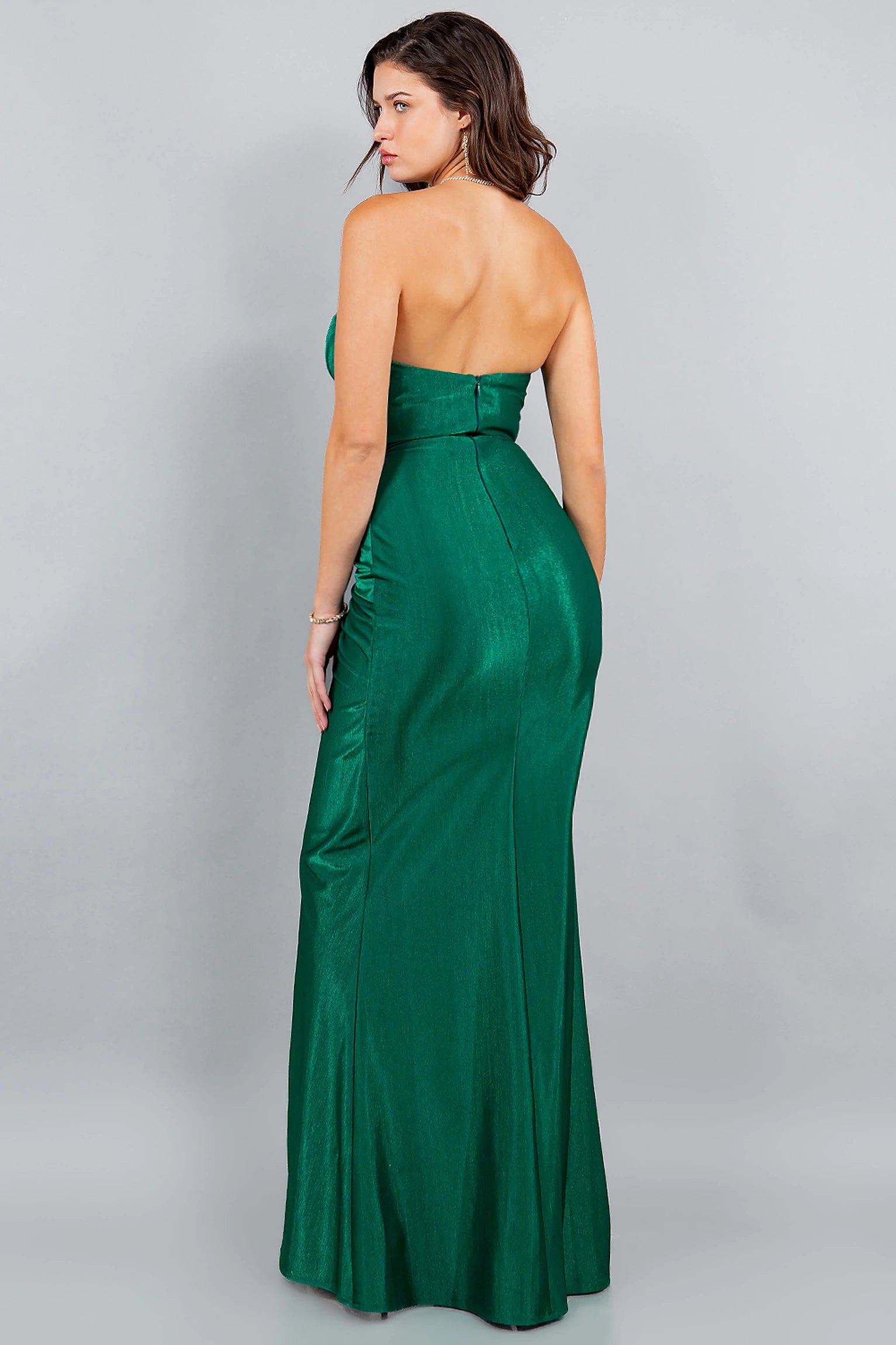 Green prom dress designed with zipper back closure