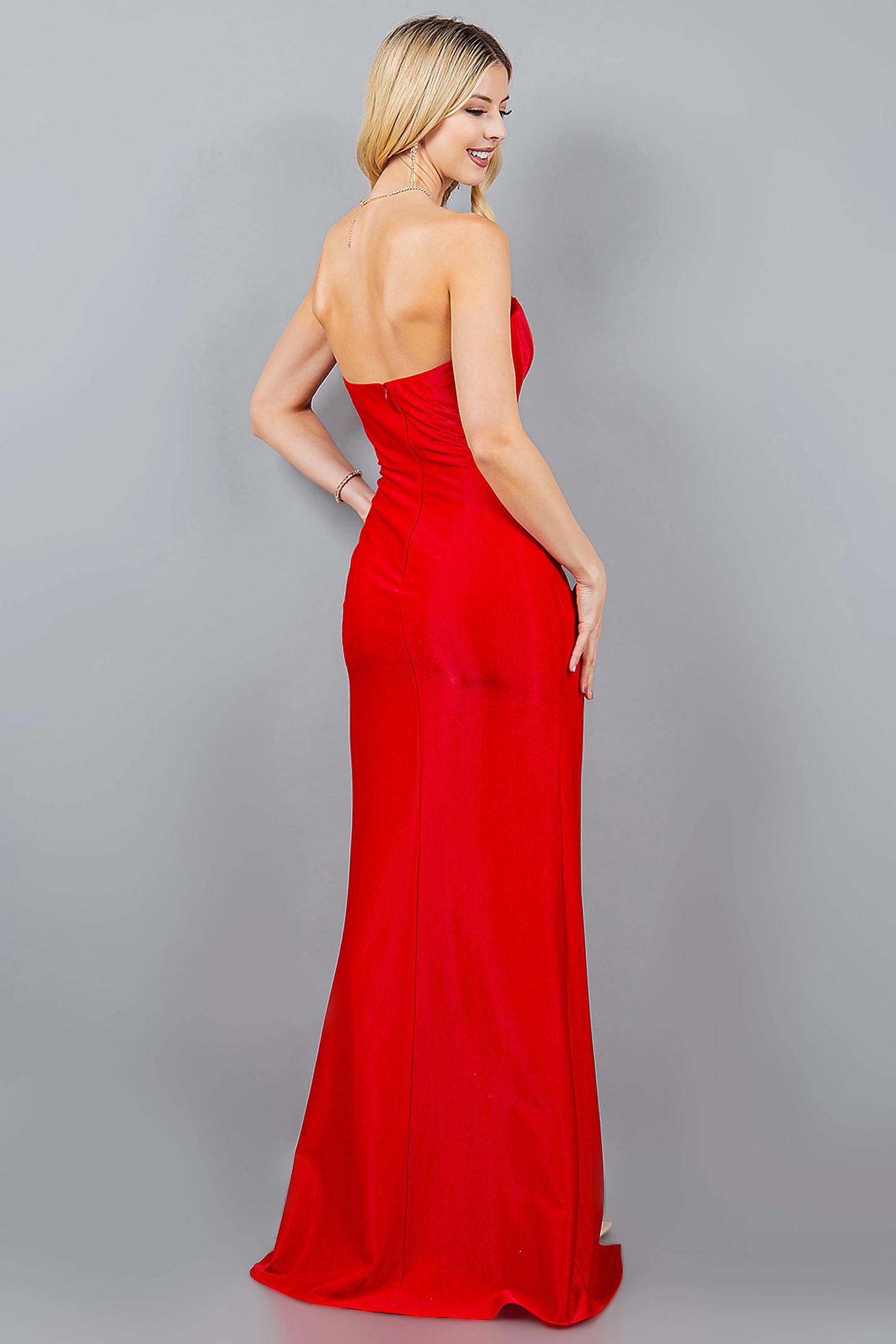 Red prom dress designed with zipper back closure