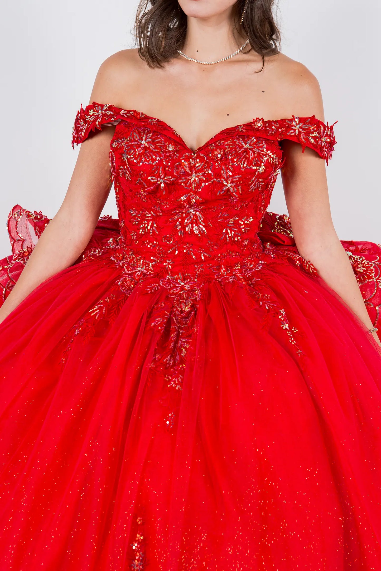 Red off-shoulder quinceanera gown with intricate detailing 