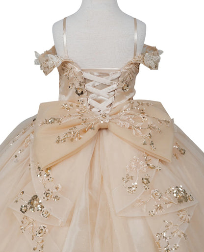 Champagne front view kids mini quinceañera ball gown with floral lace embellishments and glitter tulle skirt