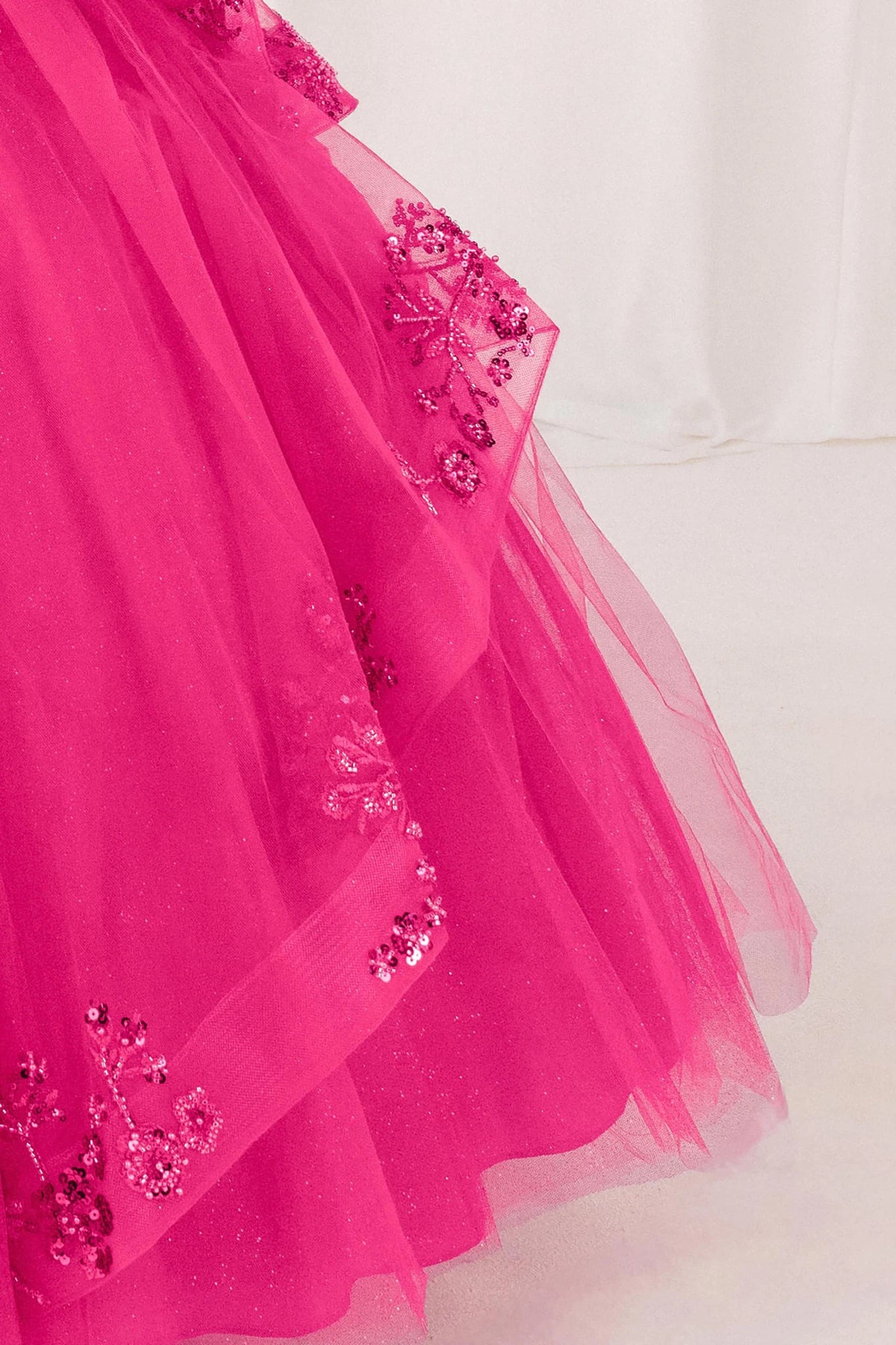 Fuchsia detail zoom kids mini quinceañera ball gown with floral lace, bead embroidery and glitter tulle fabric
