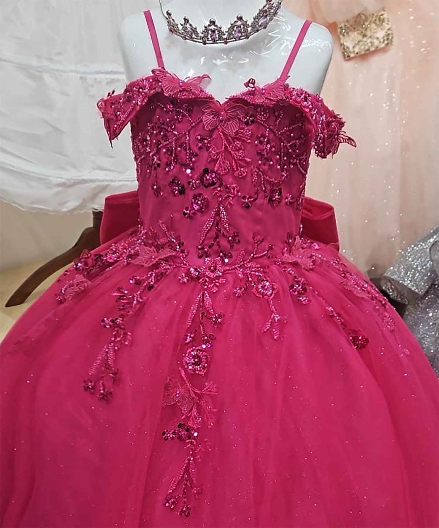 Fuchsia mannequin view kids mini quinceañera ball gown with bead embroidery, floral lace and glitter tulle skirt