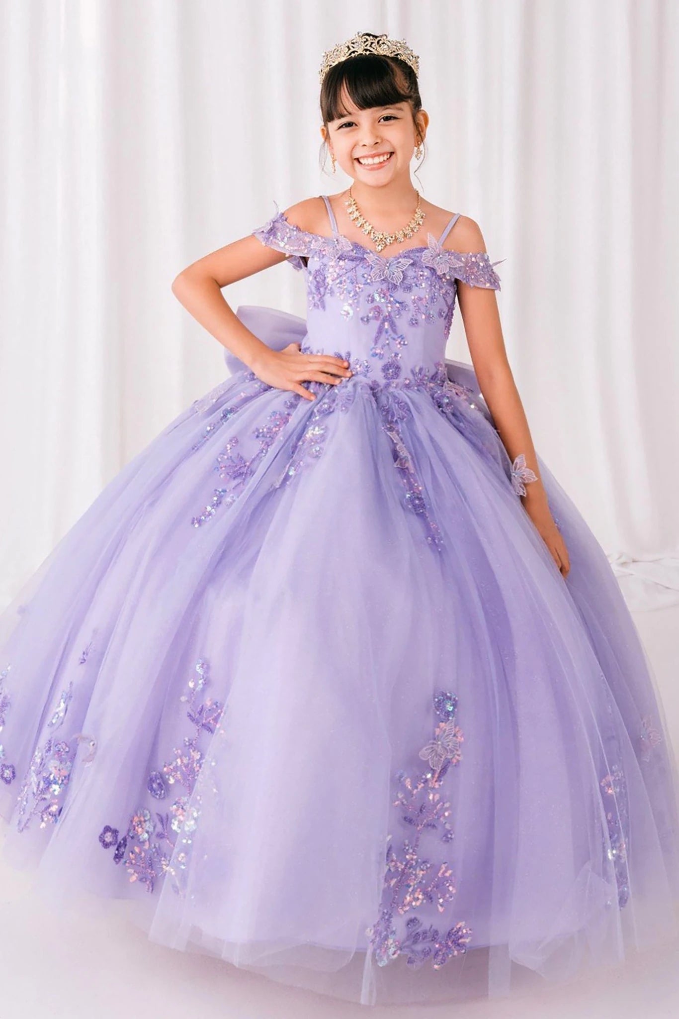 Lilac front view kids mini quinceañera mini quince dress with bead embroidered butterfly applique, A-line silhouette and sweep train.