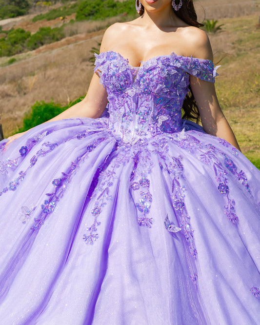 lilac ball gown with floral details worn by a person outdoors.