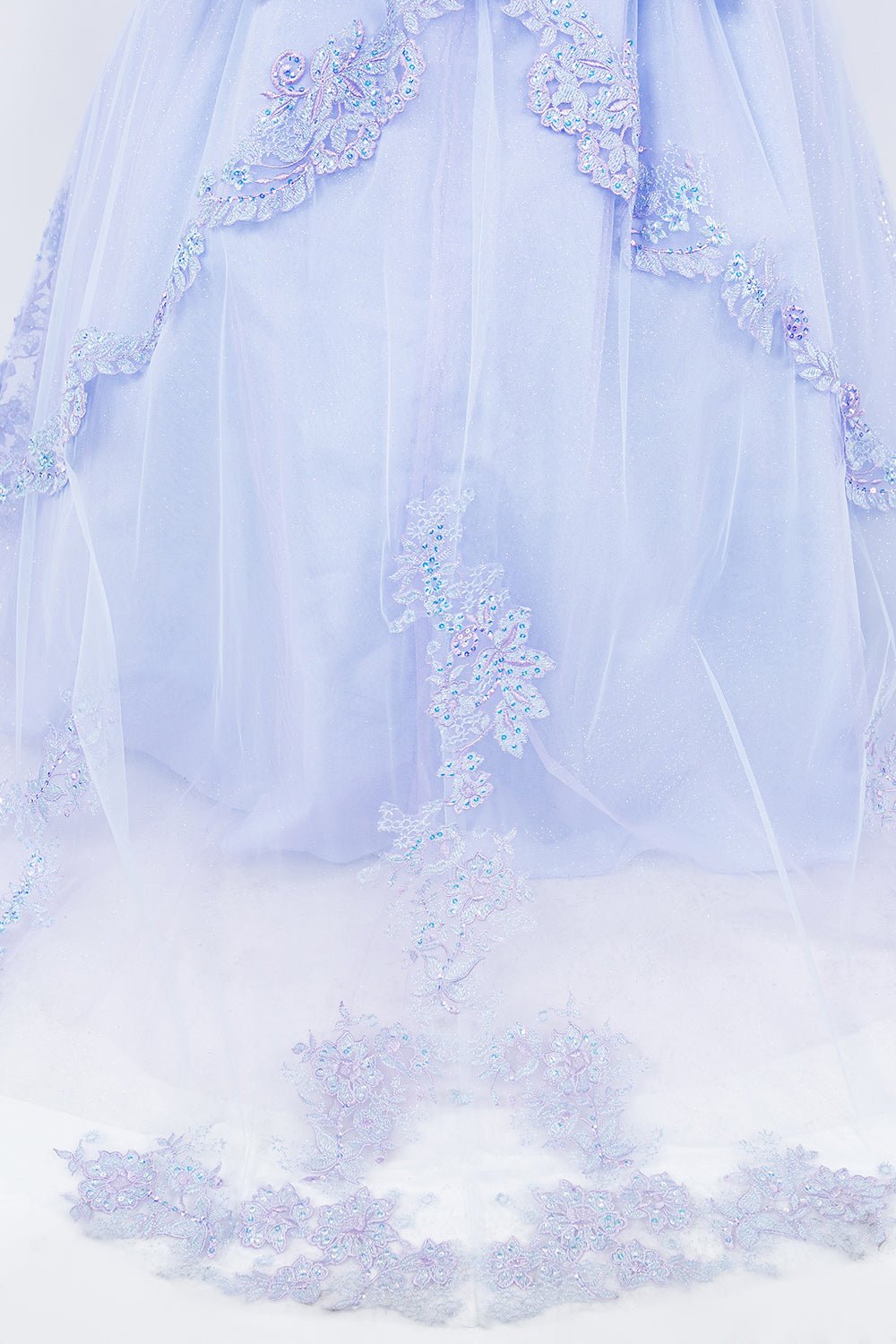 Lilac tulle zoom kids mini quinceañera mini quince dress with two-tone embroidered corset, floral lace and layered tulle fabric.