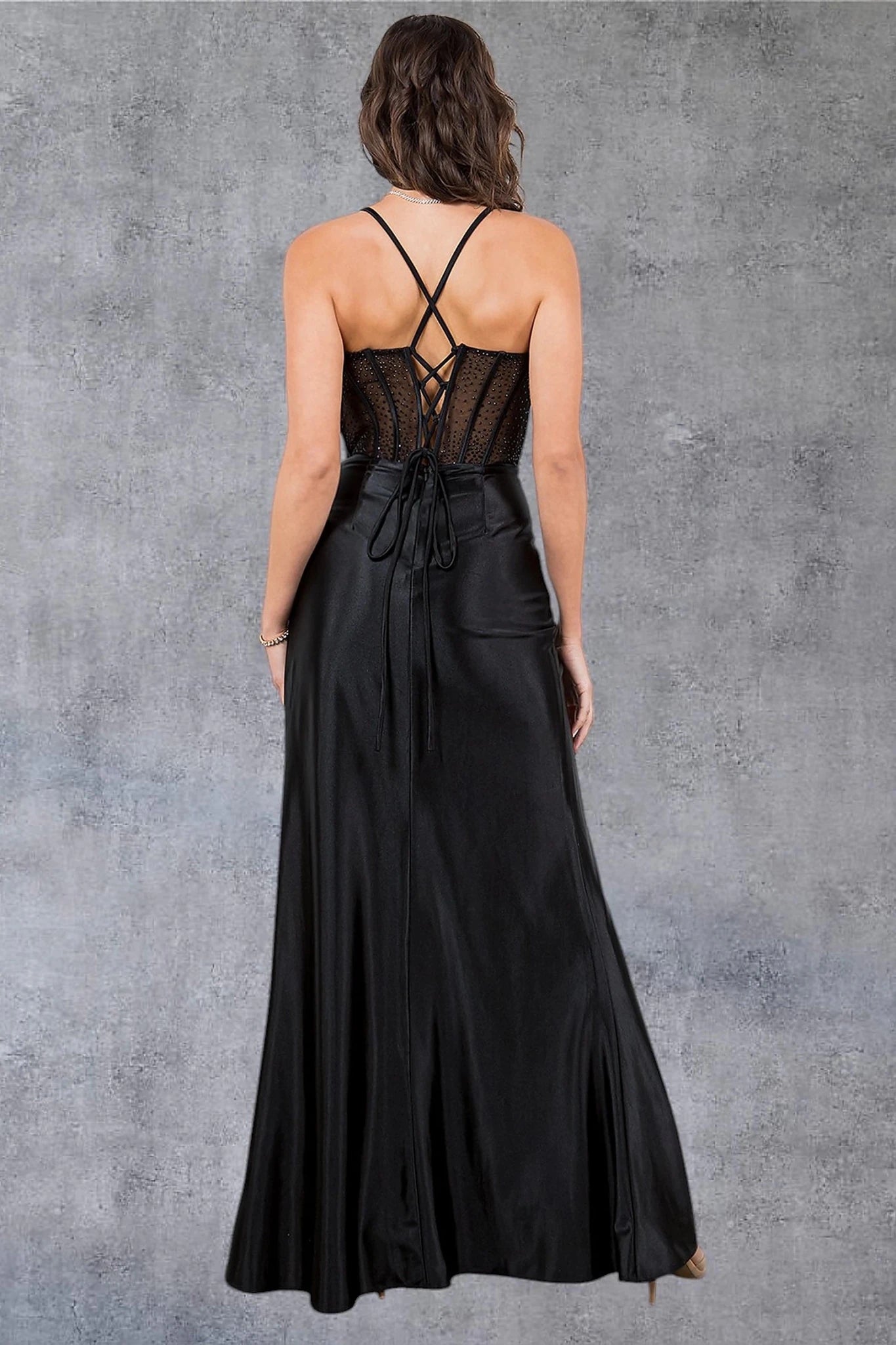 Black prom dress completed with lace-up spaghetti back and zipper closure