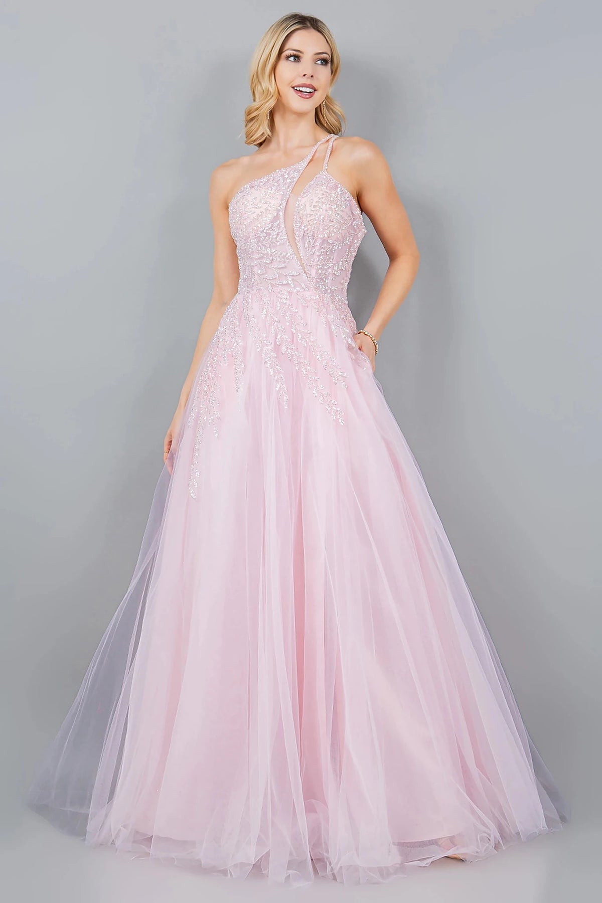 Bodice close-up highlights pink prom dress with one-shoulder strap neckline.