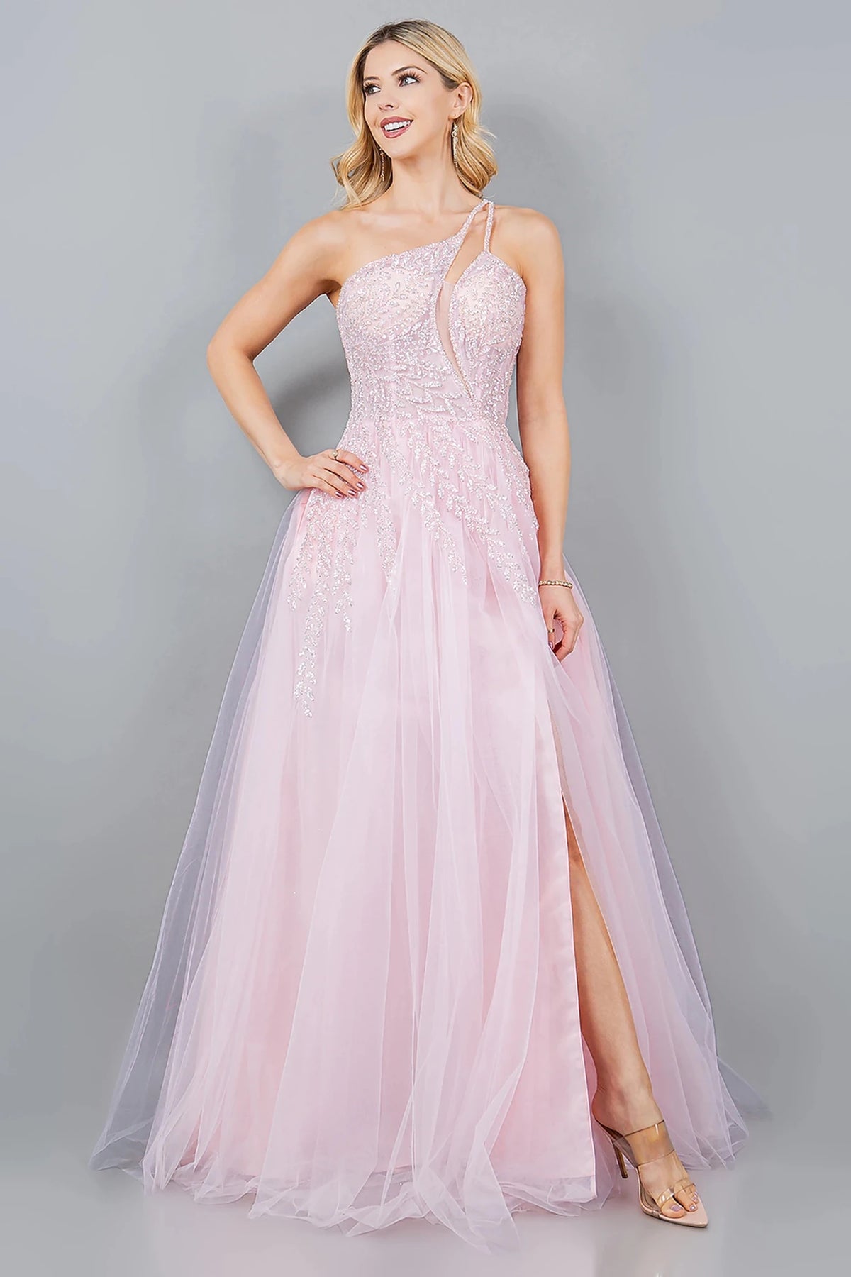 Intricate features stand out across pink prom dress completed with floor-length skirt and high side slit.