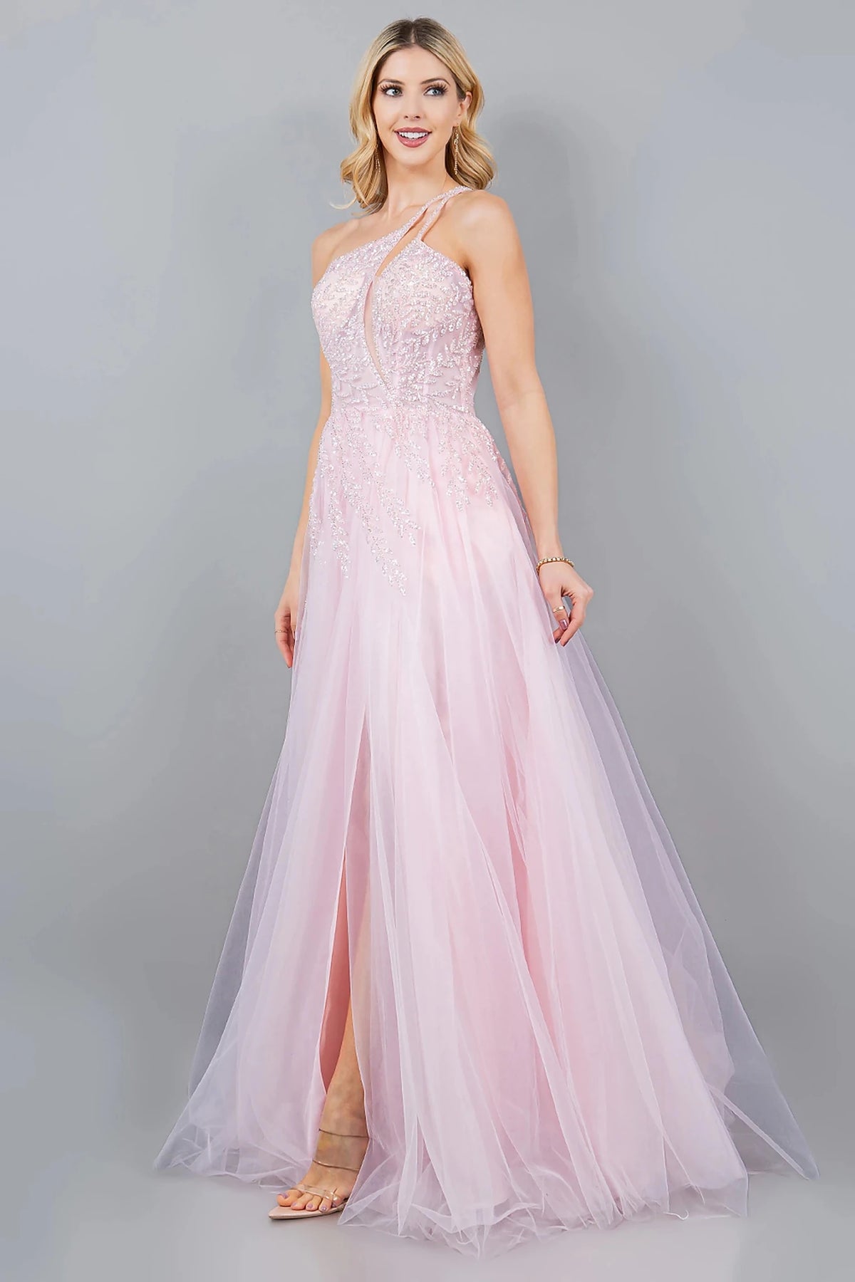 Textured details appear across pink prom dress styled with fitted A-line silhouette in layered tulle.