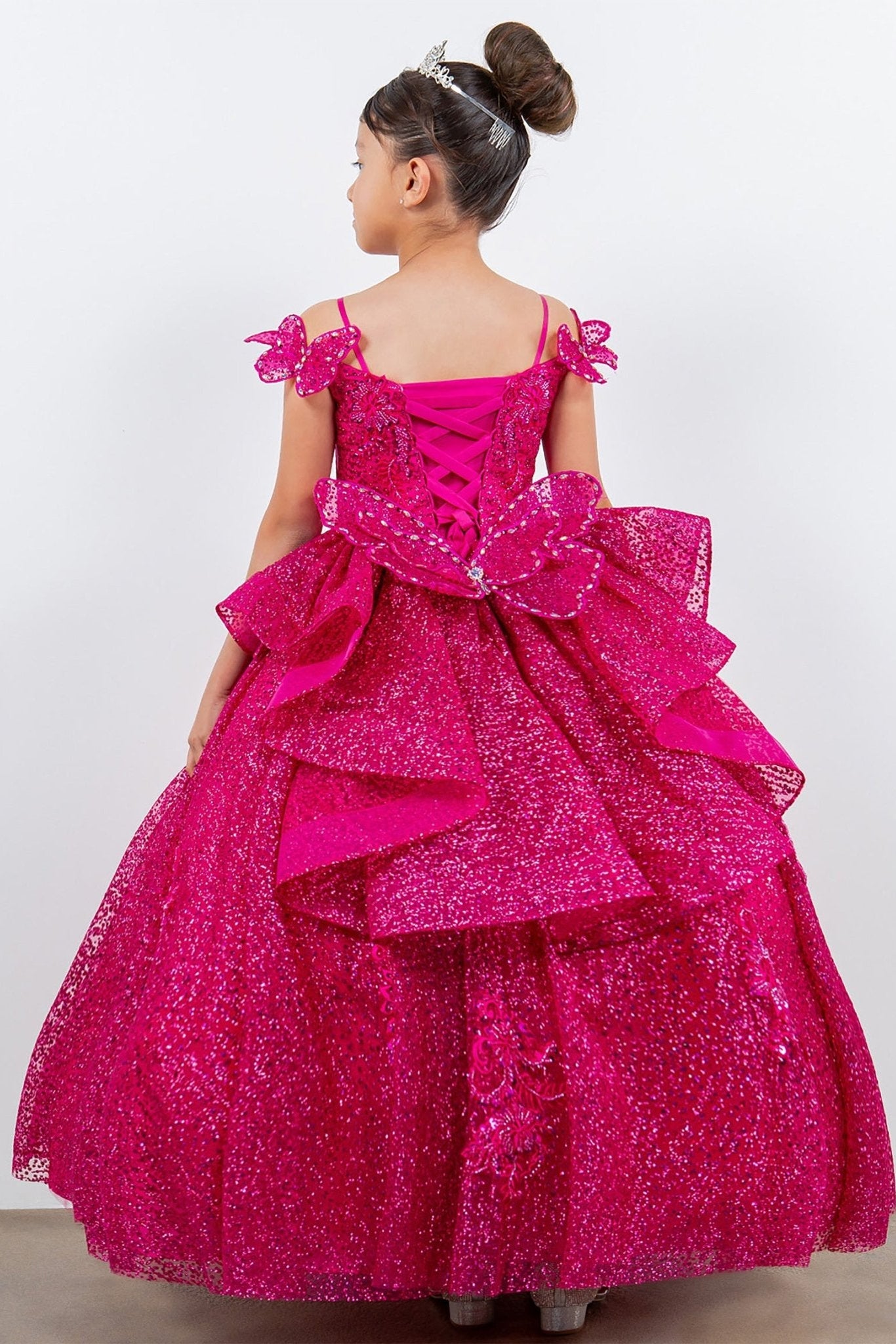 Front view of fuchsia mini quince dress with butterfly lace beaded floral bodice layered tulle skirt.