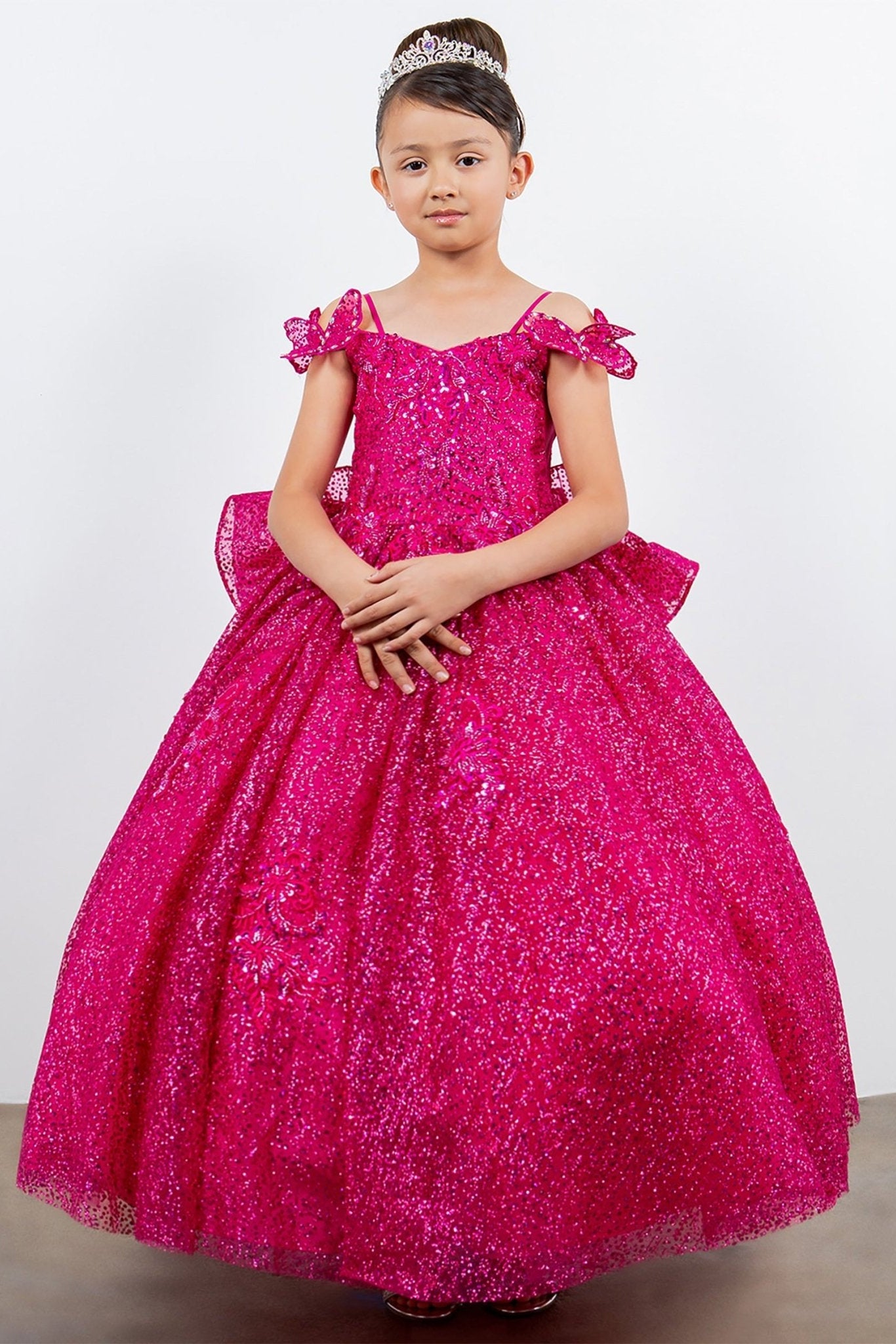 Front view of fuchsia mini quince dress with butterfly lace beaded floral bodice layered tulle skirt.