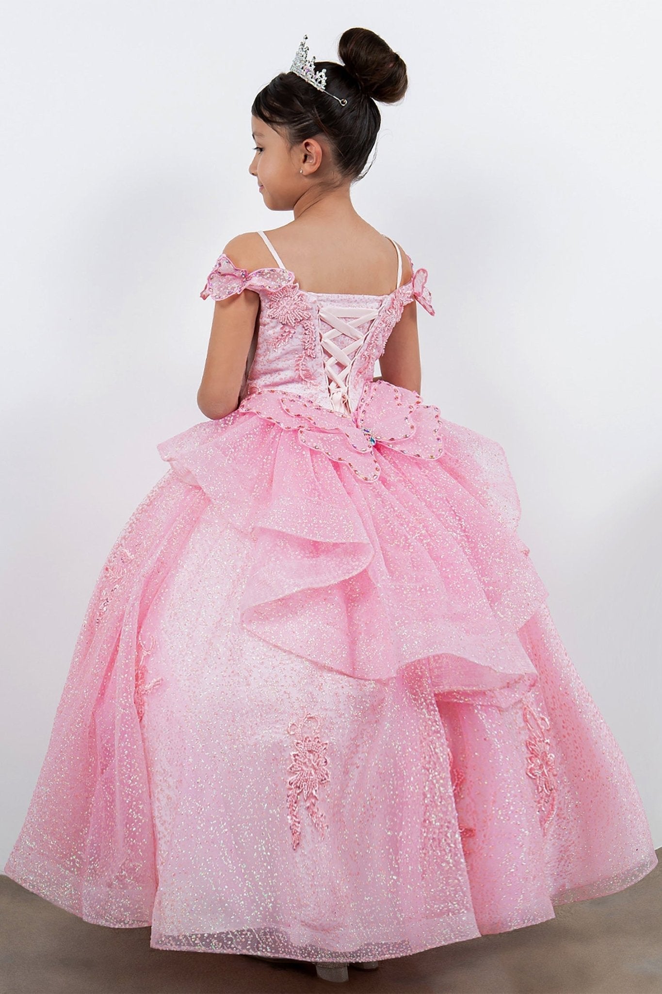 Portrait view of a pink mini quince dress with butterfly lace beaded floral bodice layered tulle skirt.