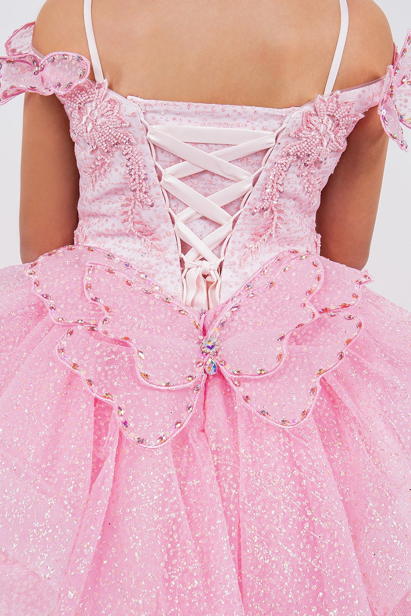 Close-up of pink mini quince dress with butterfly lace beaded floral bodice layered tulle detailing