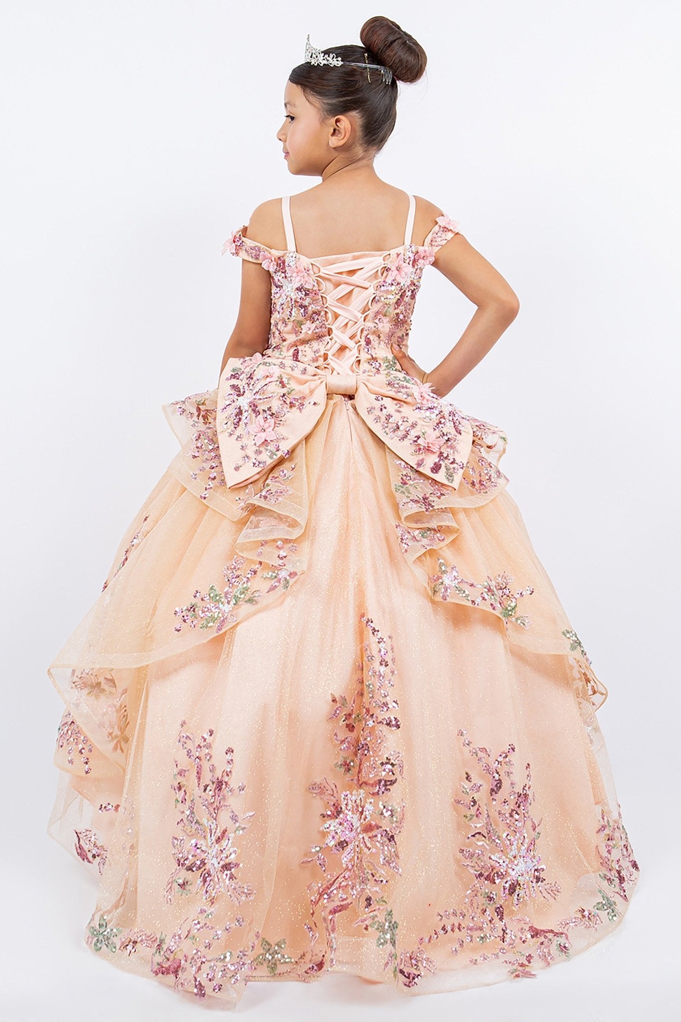 Back view of peach blush kids mini quince dress with 3D beaded floral applique off-shoulder tulle train.