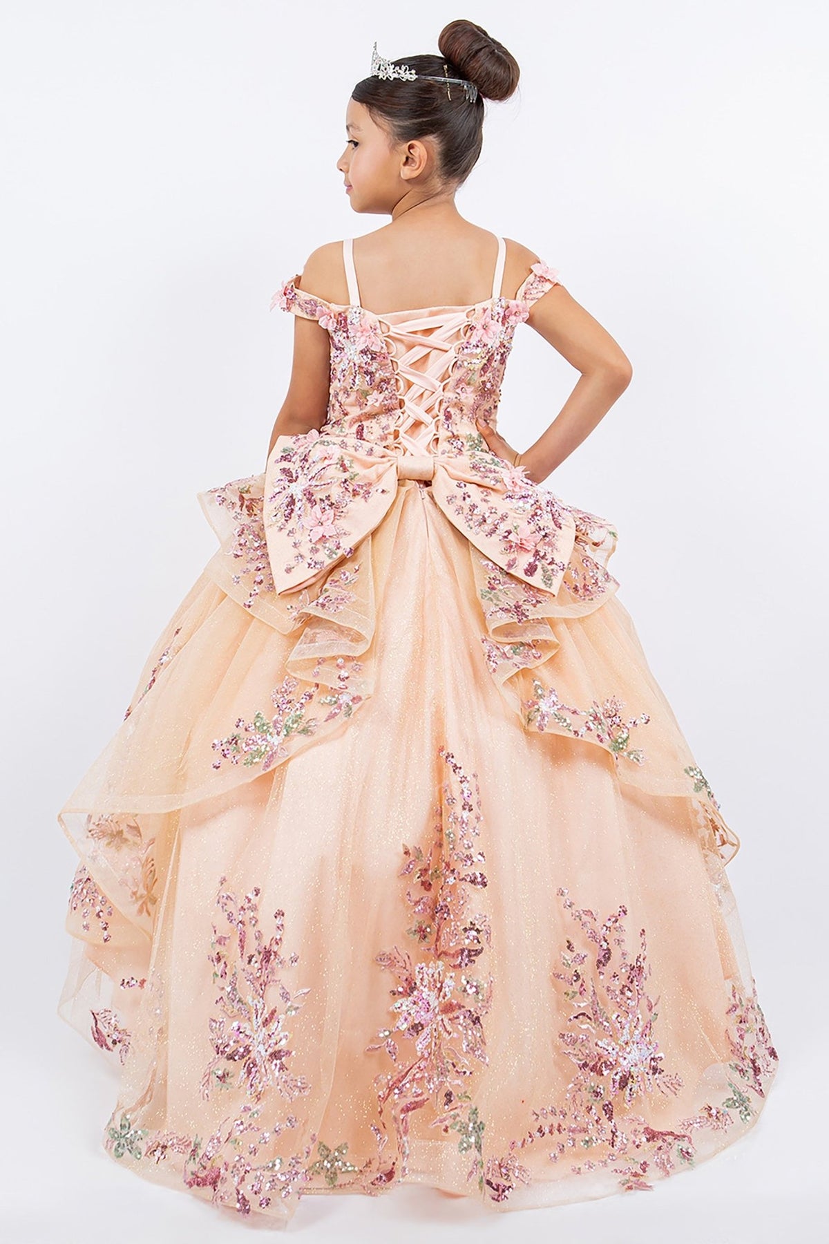 Back view of peach blush kids mini quince dress with 3D beaded floral applique off-shoulder tulle train.