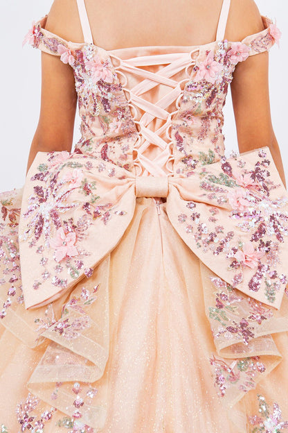 Back detail shows a peach blush kids mini quince dress with 3D beaded floral applique glitter tulle with big bow.