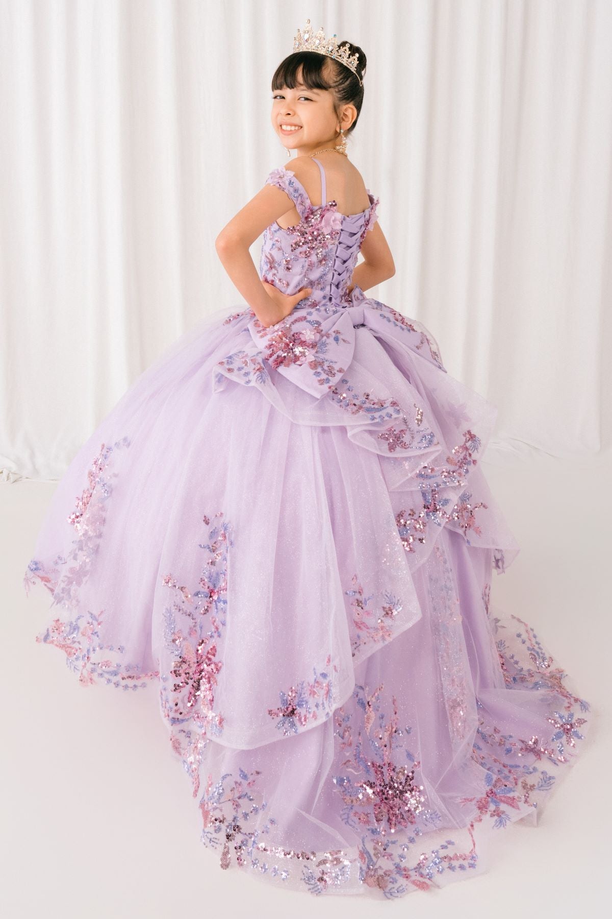 Lilac front view kids mini quinceañera mini quince dress with off-shoulder 3D beaded floral applique, glitter tulle and train.