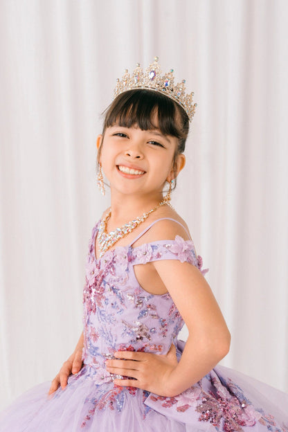 Shown in a upper-front view, the Lilac mini quince dress has off-shoulder floral embellished bodice.