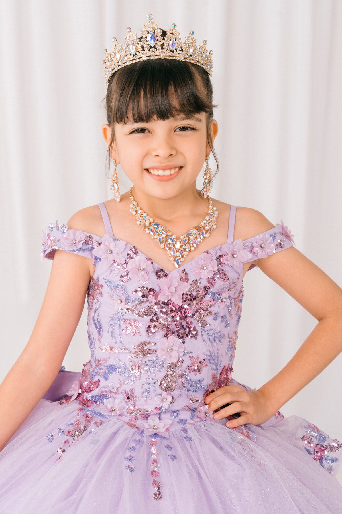 Lilac front view kids mini quinceañera mini quince dress with off-shoulder 3D beaded floral applique and glitter tulle train.