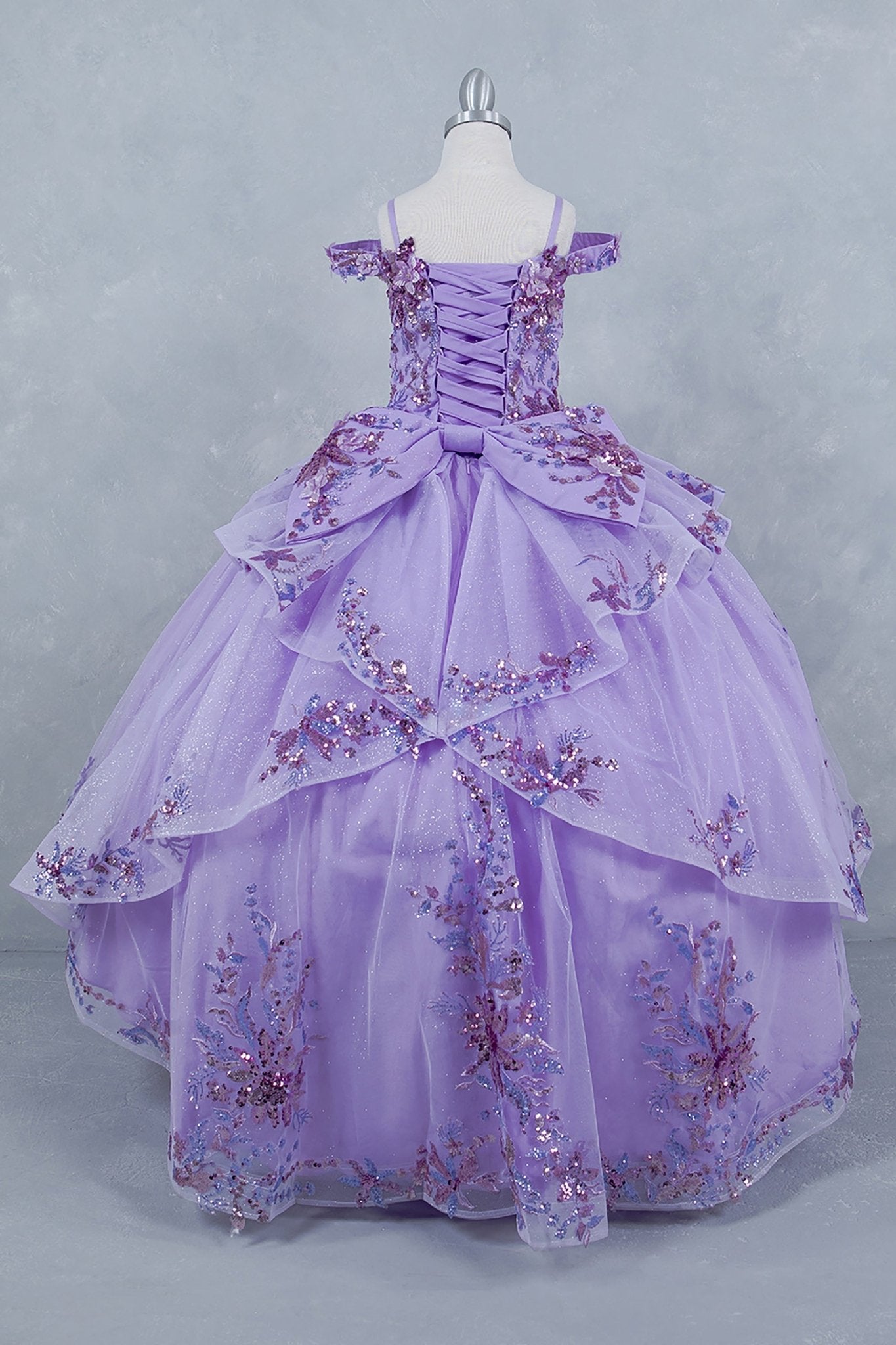 Lilac side view kids mini quinceañera mini quince dress with off-shoulder 3D beaded floral applique, glitter tulle and train.
