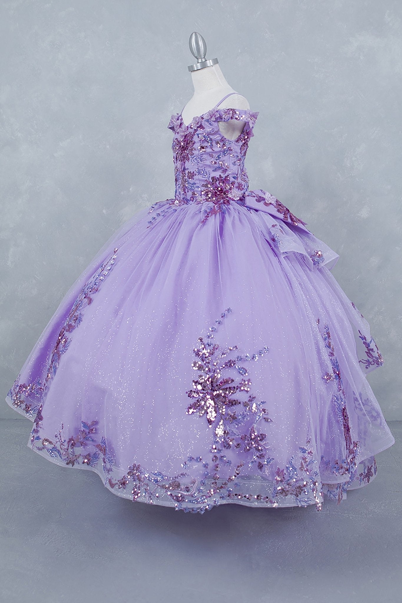Lilac back zoom kids mini quinceañera mini quince dress with off-shoulder 3D beaded floral applique, glitter tulle and train.