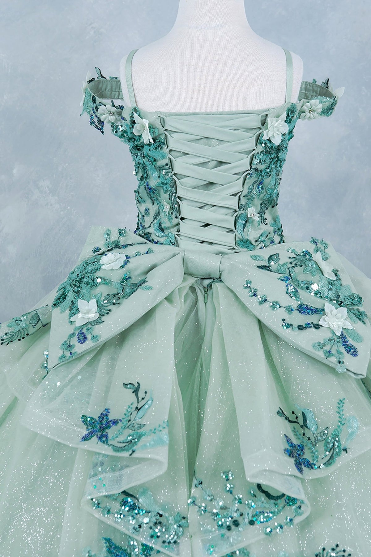 Sage back ribbon view kids mini quinceañera mini quince dress with off-shoulder 3D floral applique, glitter tulle and train.
