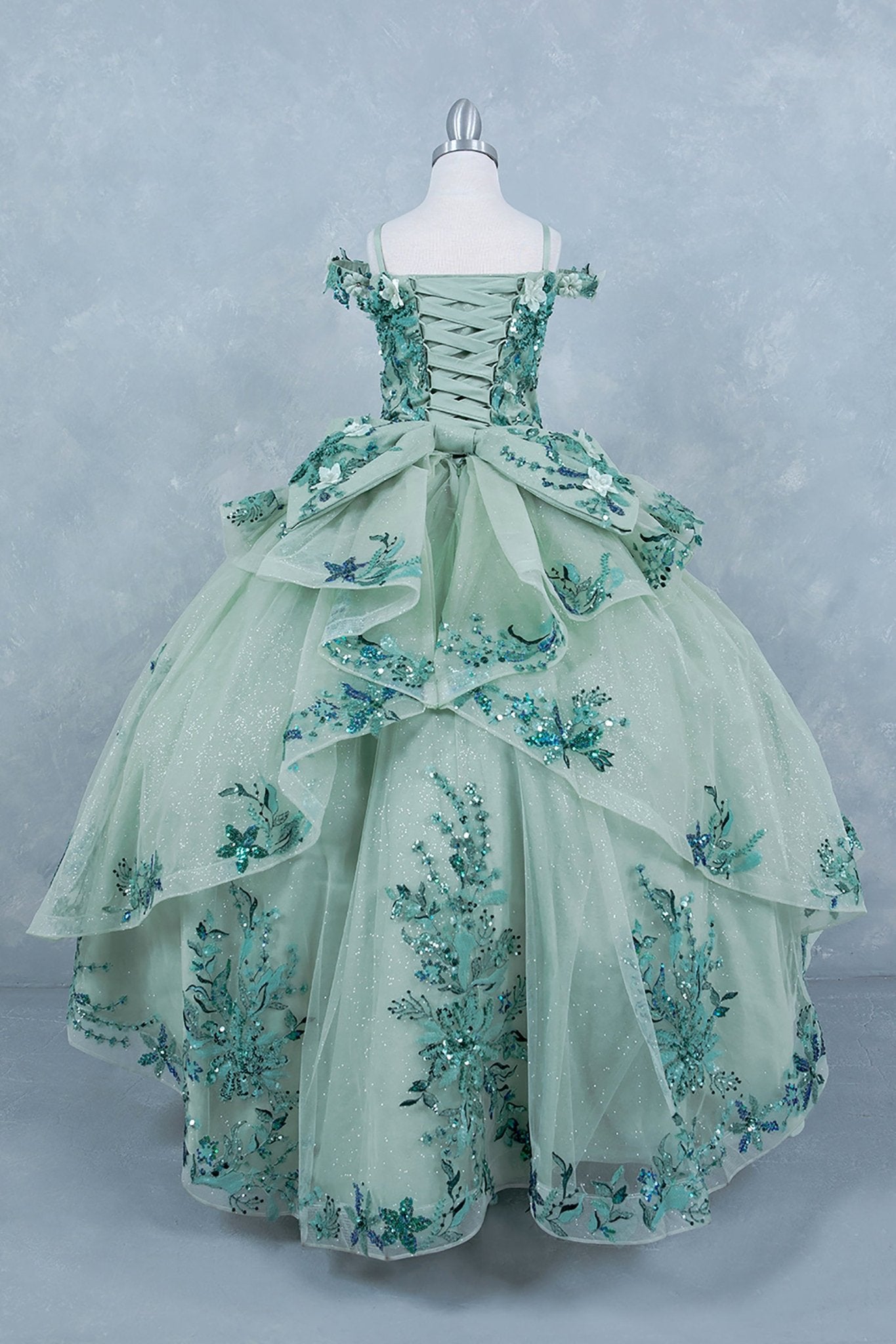 Sage back view kids mini quinceañera mini quince dress with off-shoulder 3D beaded floral applique, glitter tulle and train.