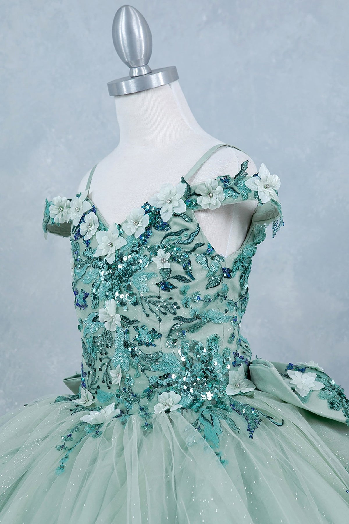 Sage side zoom kids mini quinceañera mini quince dress with off-shoulder 3D beaded floral applique, glitter tulle and train.