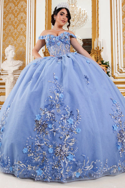 Front view of a woman wearing blue quinceanera ball gown with seven-layer tulle skirt, floral beaded appliques, and lace-up corset