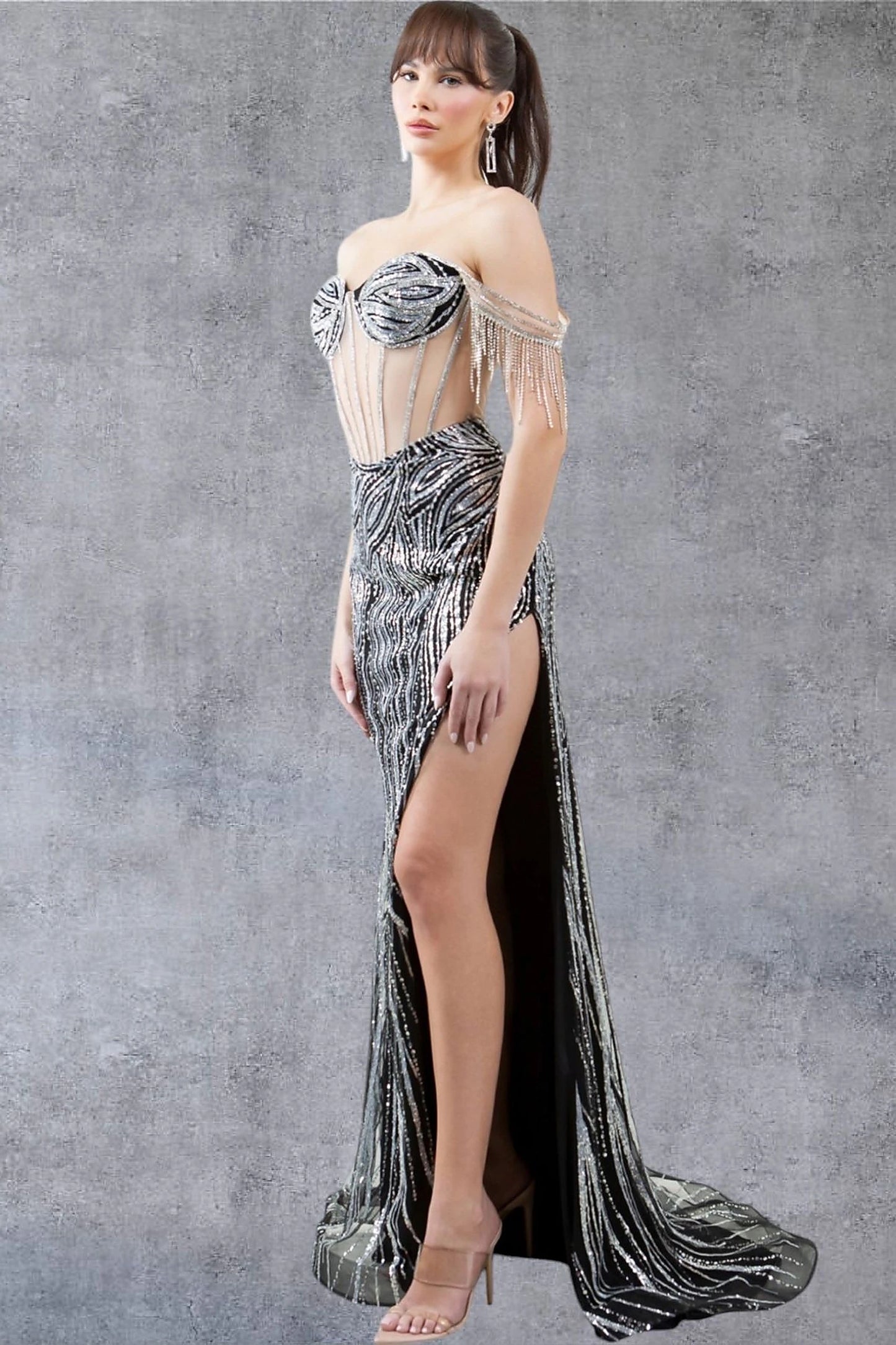 Black prom dress completed with thigh-high slit and see-through corset back