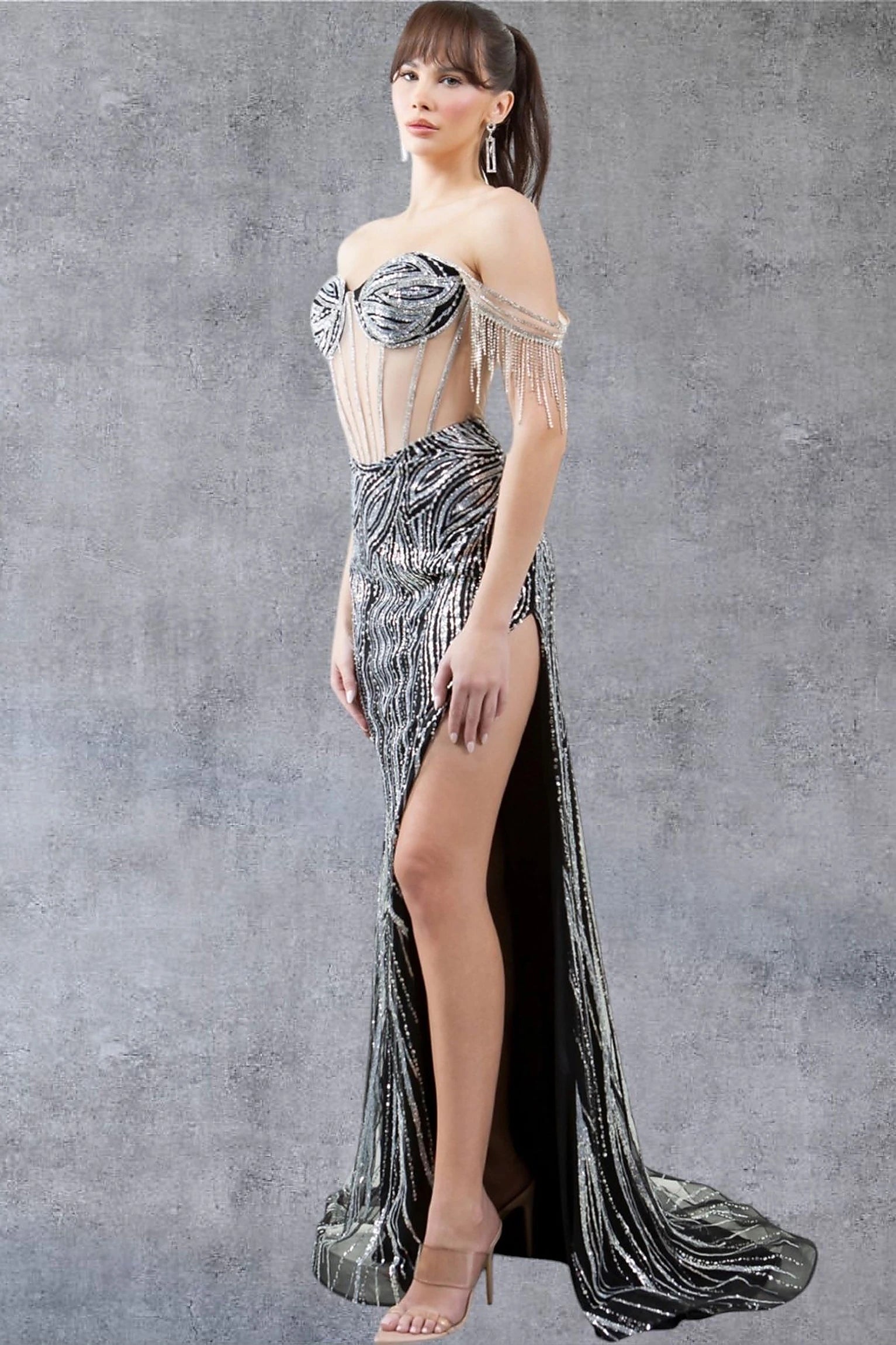 Black prom dress completed with thigh-high slit and see-through corset back